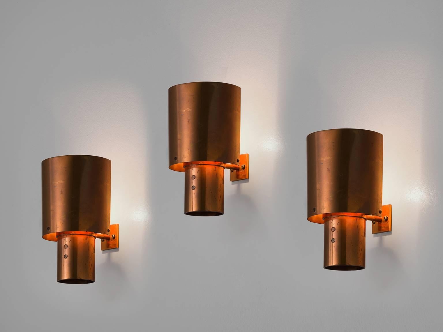 Set of three sconces, in copper, Europe, 1970s. 

Set of three copper wall lights. These lights have a simplistic design that resembles the style of the Danish architect Halldor Gunnløgsson. The focus lies completely on the material. The copper
