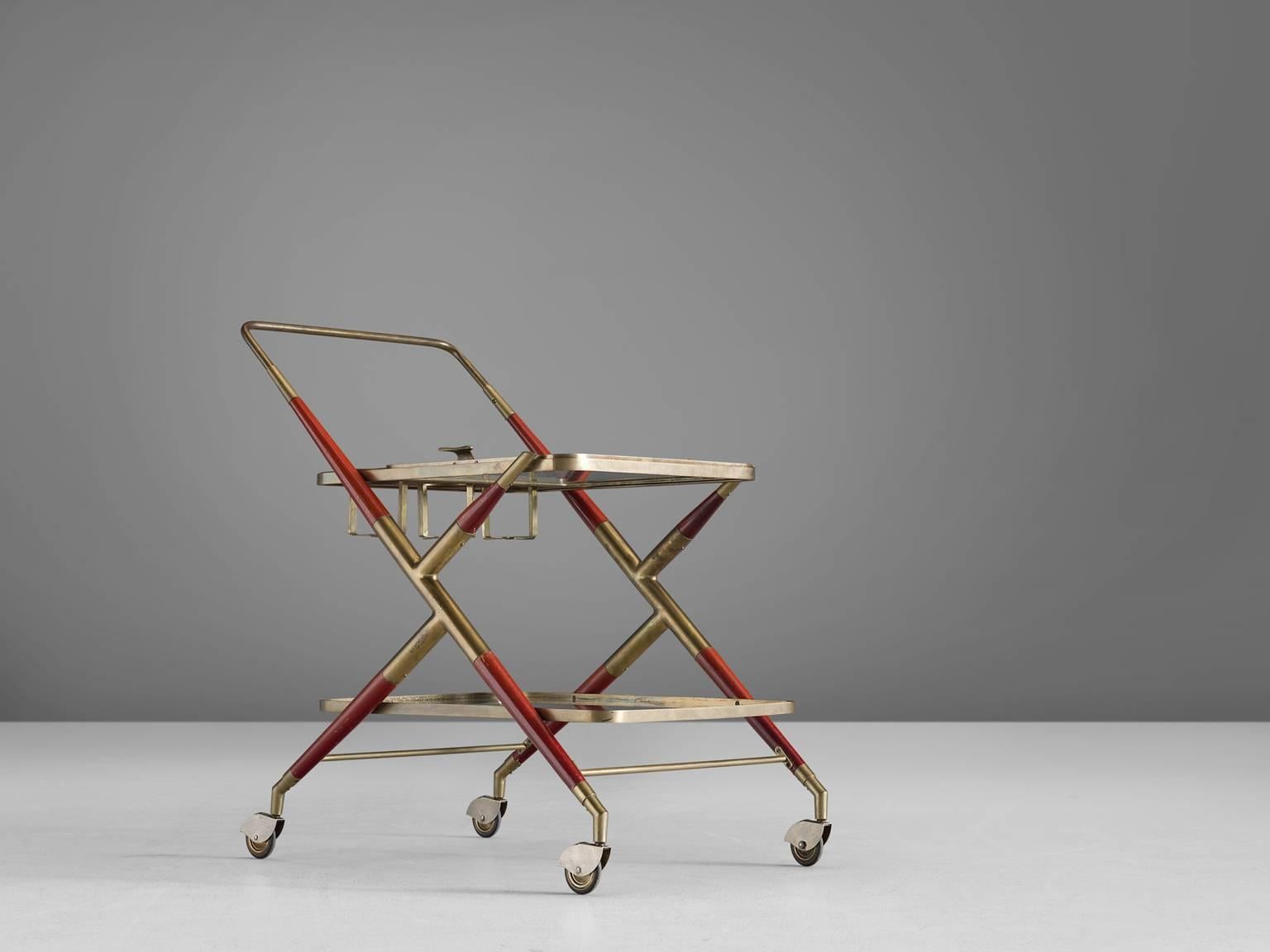 Cesare Lacca, trolley, brass, red colored wood and glass, Italy, 1960s. 

This delicate trolley is executed in wood, brass and glass. The trolley has a wonderful combination of brass and wooden elements that are painted red. The transparent design