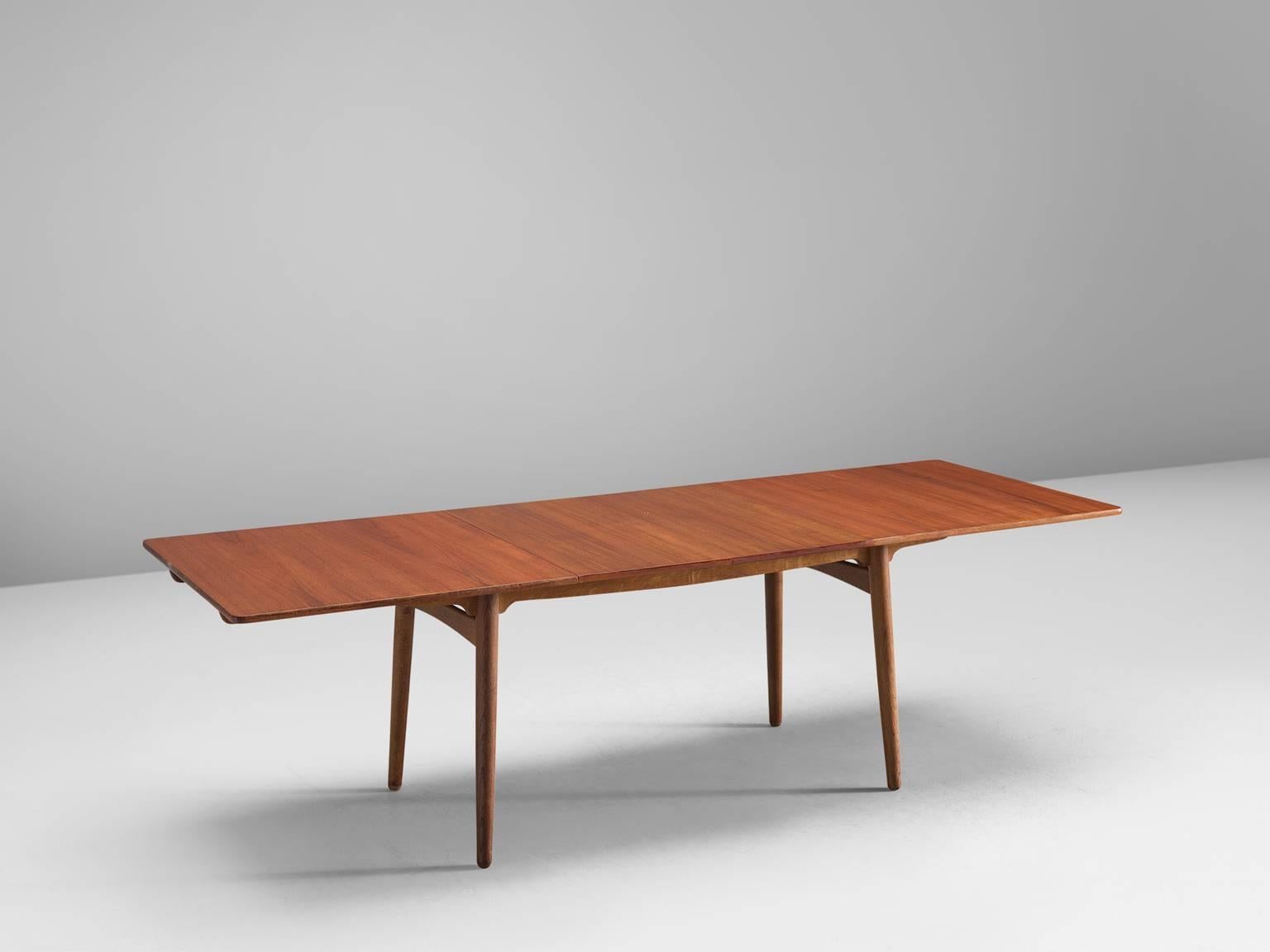 Hans J. Wegner for Andreas Tuck, 'AT-310', teak, Denmark, 1950s.

This extendable AT-310 dining table designed by Hans J. Wegner is made from teak and has extra leaves in order to expand the piece from a six-seat (160cm) to a ten-seat capacity (240