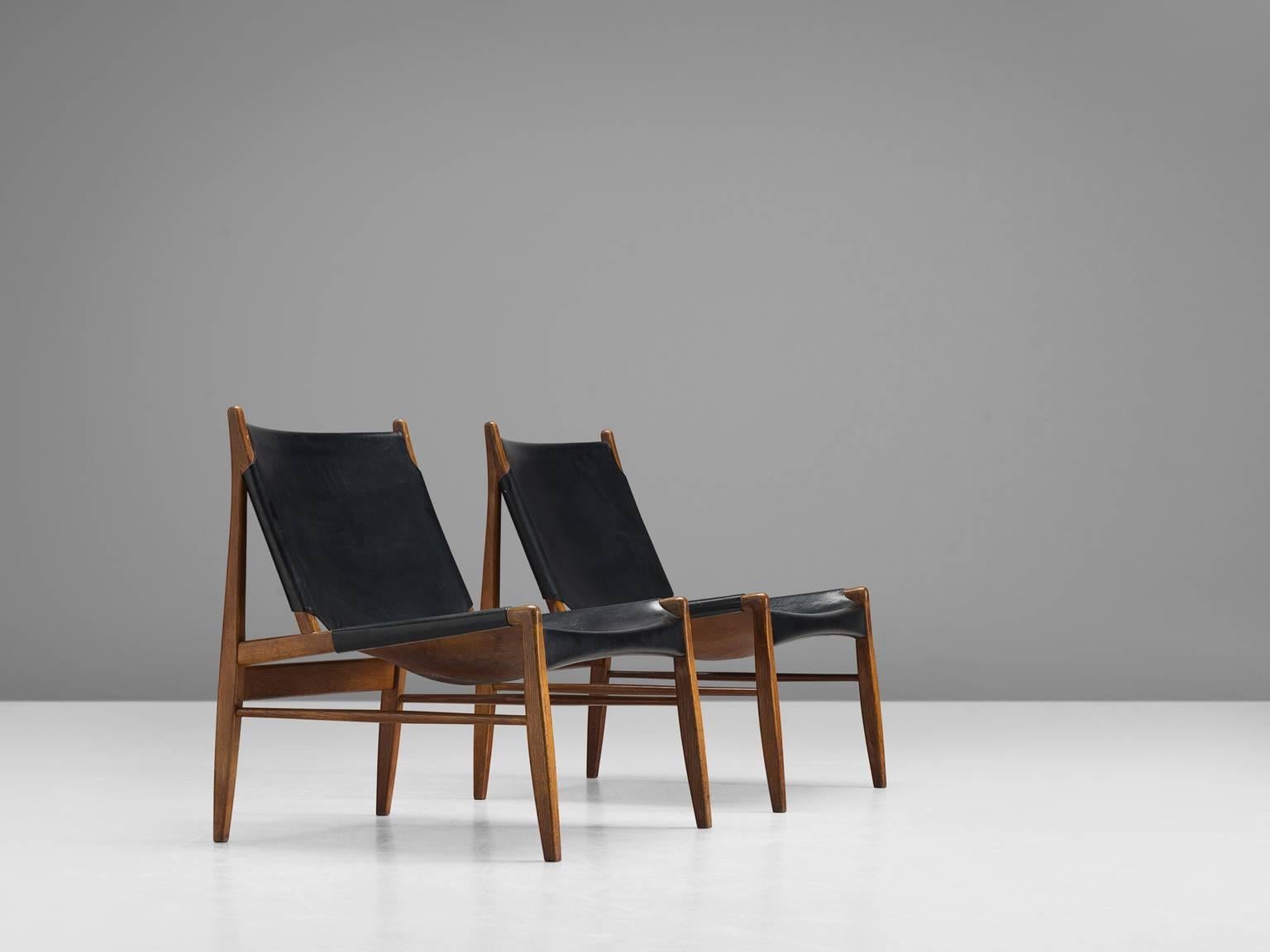 'Chimney' chairs, oak and patinated black leather by Franz Xaver Lutz for WK Verband, Germany, 1958, Germany. 

These early Chimney chairs by Franz Xaver Lutz bears strong resemblances to Spanish and Scandinavian hunting chairs. The design is