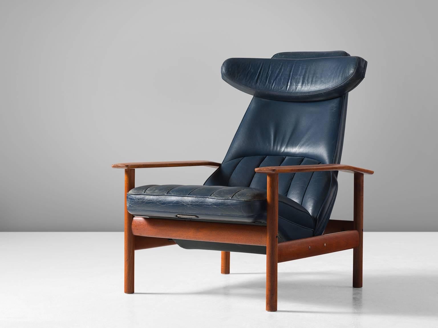 Sven Ivar Dysthe, lounge chair, teak and leather, Norway, 1960s.

This easy chair by Sven Ivar Dysthe with solid teak frame. The chair is adjustable in two positions to maximize comfort. The seat is covered in its original dark blue skai in a