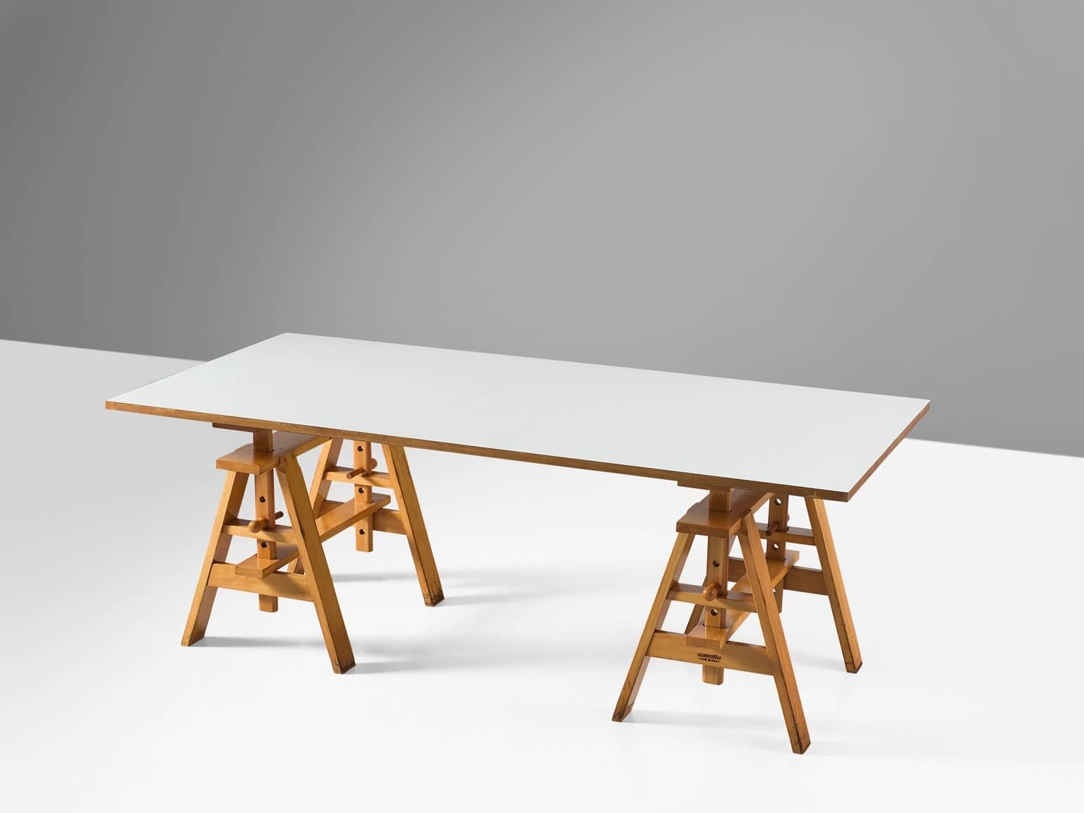 Achille Castiglioni for Zanotta, 'Leonardo' table, beech, particle Italy, design 1868, production 1980s.

This 'Leonardo' table is made and with wood trestles with a thick particleboard top coated with white plastic laminate. The table is part of