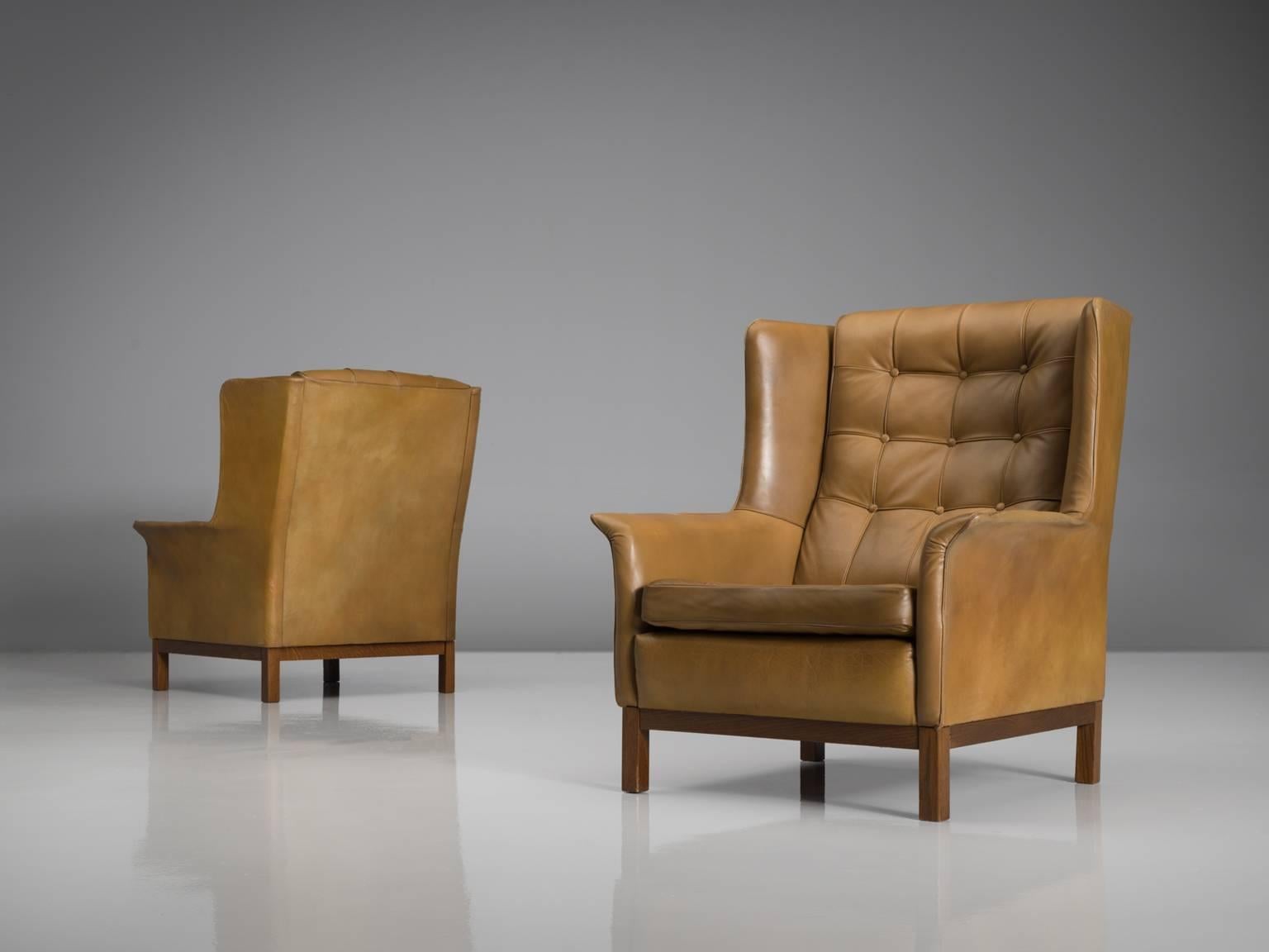 Scandinavian Modern Arne Norell Matching Pair of High Back Chairs in Patinated Cognac Leather