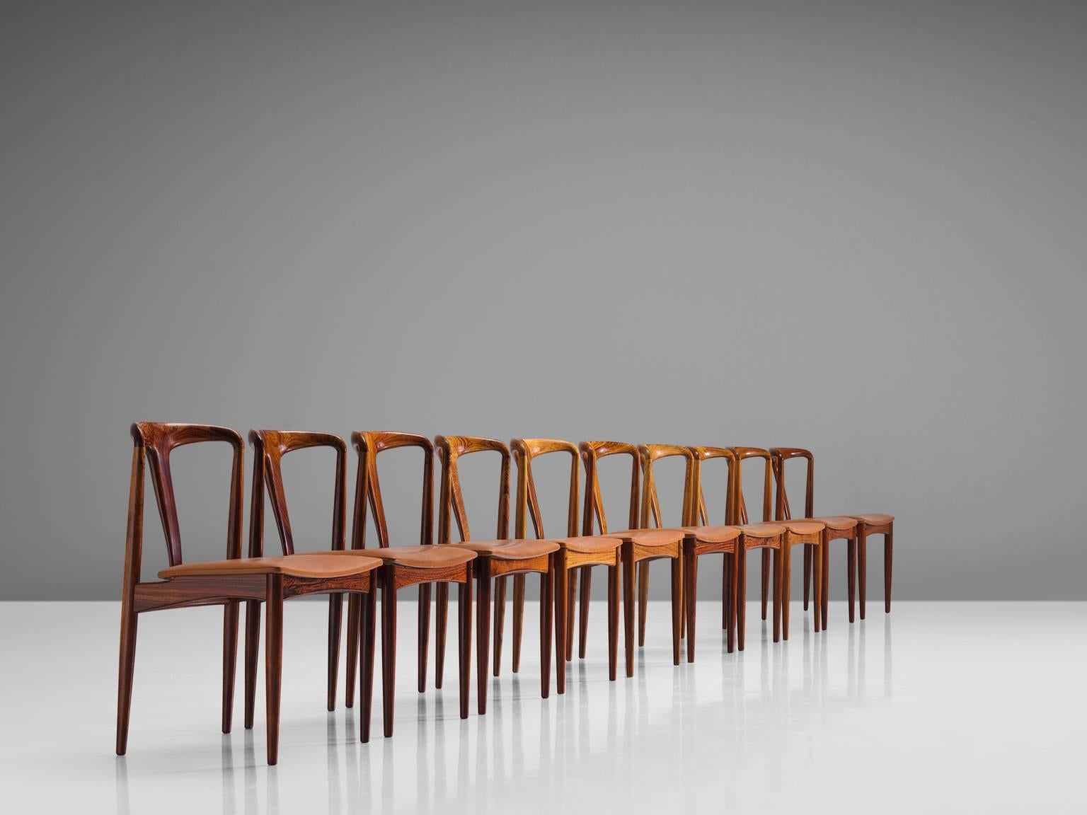Johannes Andersen for Uldum Møbelfrabrik, rosewood, brown cognac leather, Denmark, 1960s.

This large set of dining chairs is designed by the Dane Johannes Andersen and produced by Uldum Møbelfrabrik in Denmark. The set is executed with rosewood