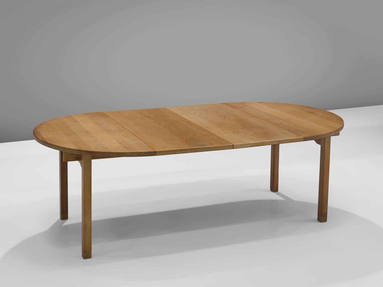 Kurt Østervig by KP Møbler, oak, Denmark, 1960s.

This extendable table in solid oak was designed in the 1960s by Kurt Østervig. The Danish design is solid, modest and well-constructed. The table can be extended or used as a circular, small kitchen