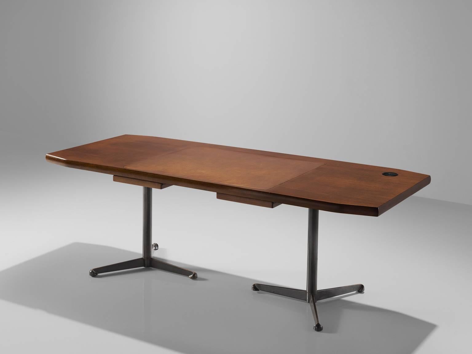 Osvaldo Borsani for Tecno, walnut, metal, steel, Italy, 1950s. 

This walnut conference table by Osvaldo Borsani for Tecno. This table is in line with the well-known 'boomerang' desk. The table's top shows the beautiful grain of the walnut that