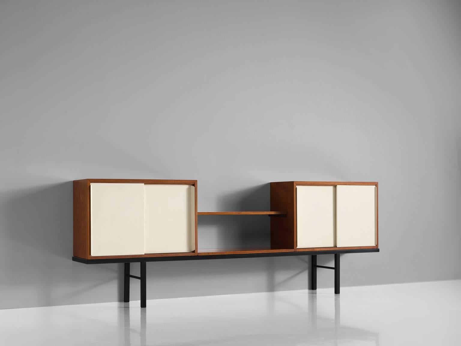 Martin Visser for 't Spectrum, Bornholm Collection KW63, wood, metal, glass, The Netherlands, 1956-1959

This rare sideboard is executed in mixed materials. The credenza features a Minimalist black metal base and two cabinets with sliding doors.