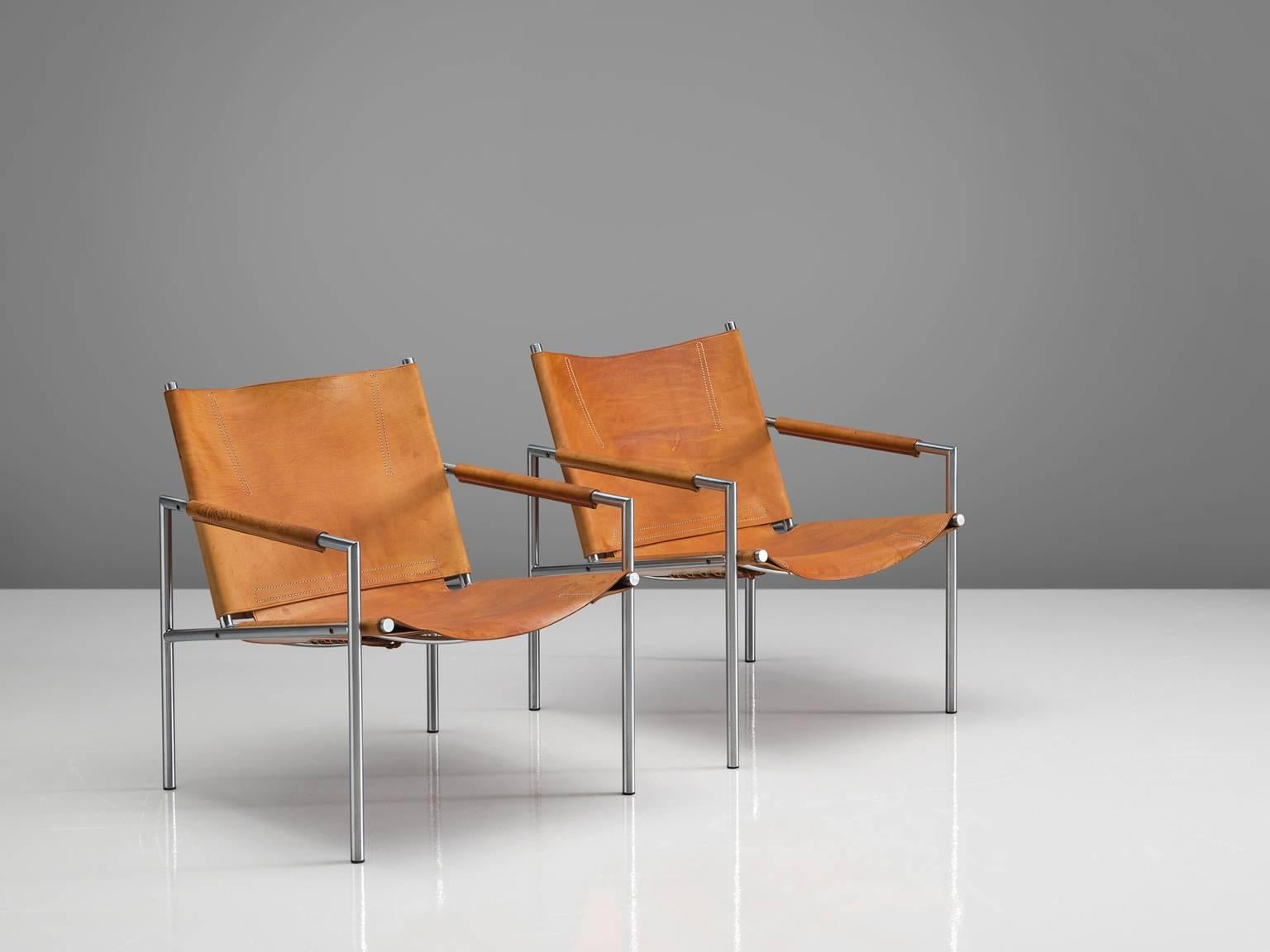 Martin Visser for 't Spectrum, set of armchairs, in steel and cognac leather, Netherlands, 1965. 

These modern, minimalist easy chairs are made of a tubular brushed steel in combination with soft, patinated high-quality cognac leather upholstery.
