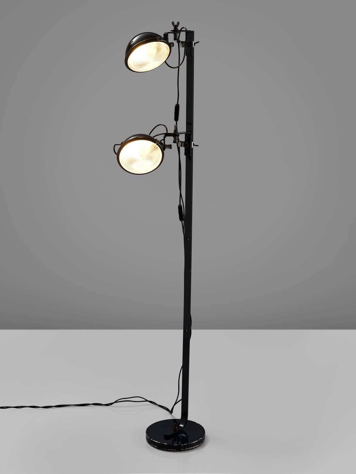 Cesare Leonardi for Lumenform, floor lamp, metal, Italy, 1950s.

Stunning floor lamp with two metal shades in all directions and can be switched of separately. Each shade is connected to the main metal rod. The shades are round and robust and have