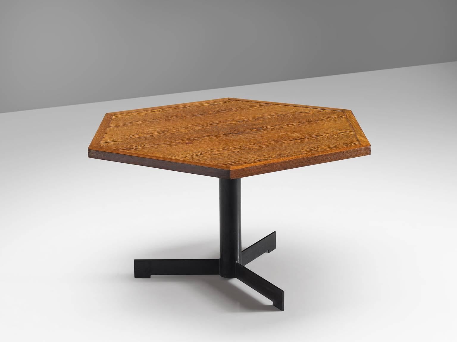 Dining table, wood, steel, Belgium, circa 1960

This sturdy and original hexagonal table features a rimmed top and a black coated pedestal leg. The leg has three feet. The design is robust and playful and is something that is most likely custom-made.