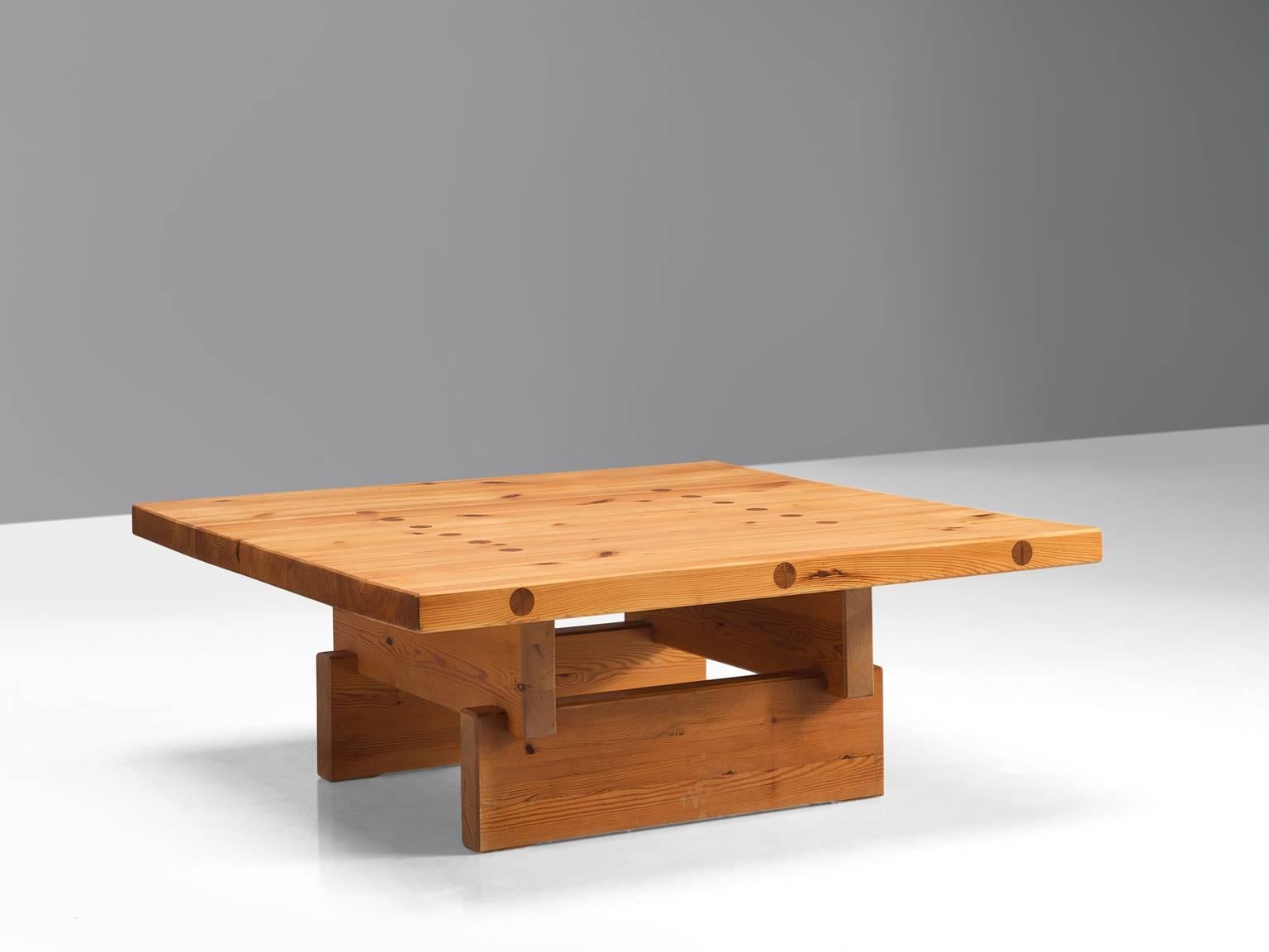 Roland Wilhelmsson for Karl Andersson & Söner, coffee table, top and frame with visible joints, Denmark, 1960s 

This remarkable solid and sturdy table holds a strong expression due to its build up with solid, horizontal and vertical planks. This