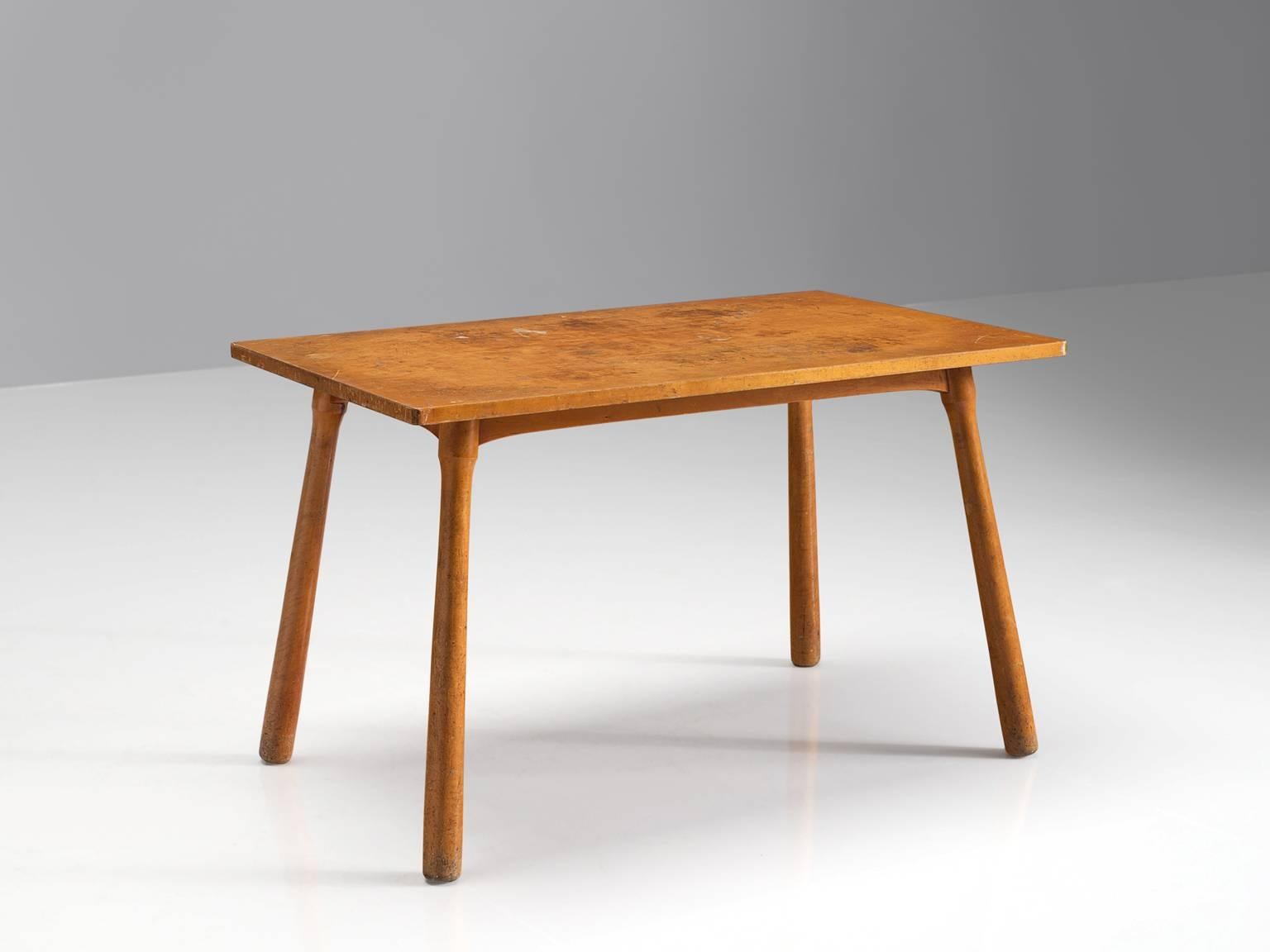 Coffee table, beech, Denmark, 1960

This modest coffee table has a simple, effective design. The top features a patinated beech rectangle. The legs are cylindrical and tapered and solid. The effect of a round solid shape of the legs with the slim