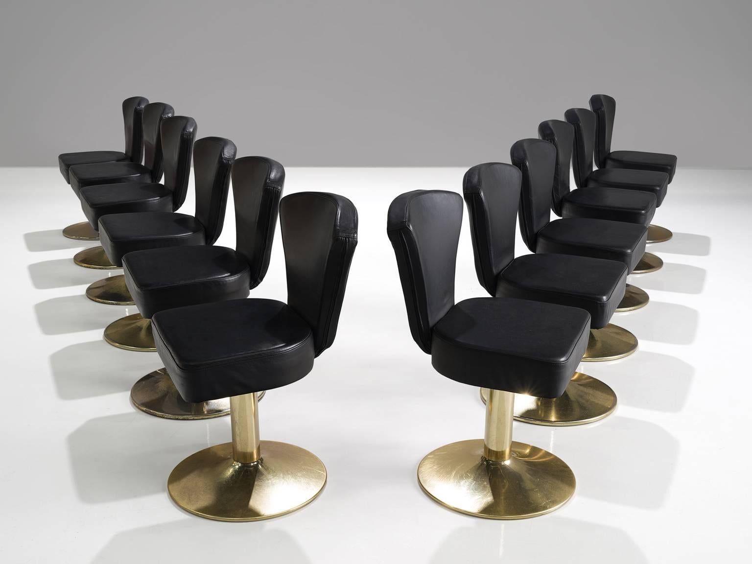 'Florence' bar stools, metal, black leatherette, Europe, design 1980s, later uphosltery.

This extraordinary set of classic Casino barstools is upholstered with a black faux leather on a gold colored metal base. The stools serve as a playful