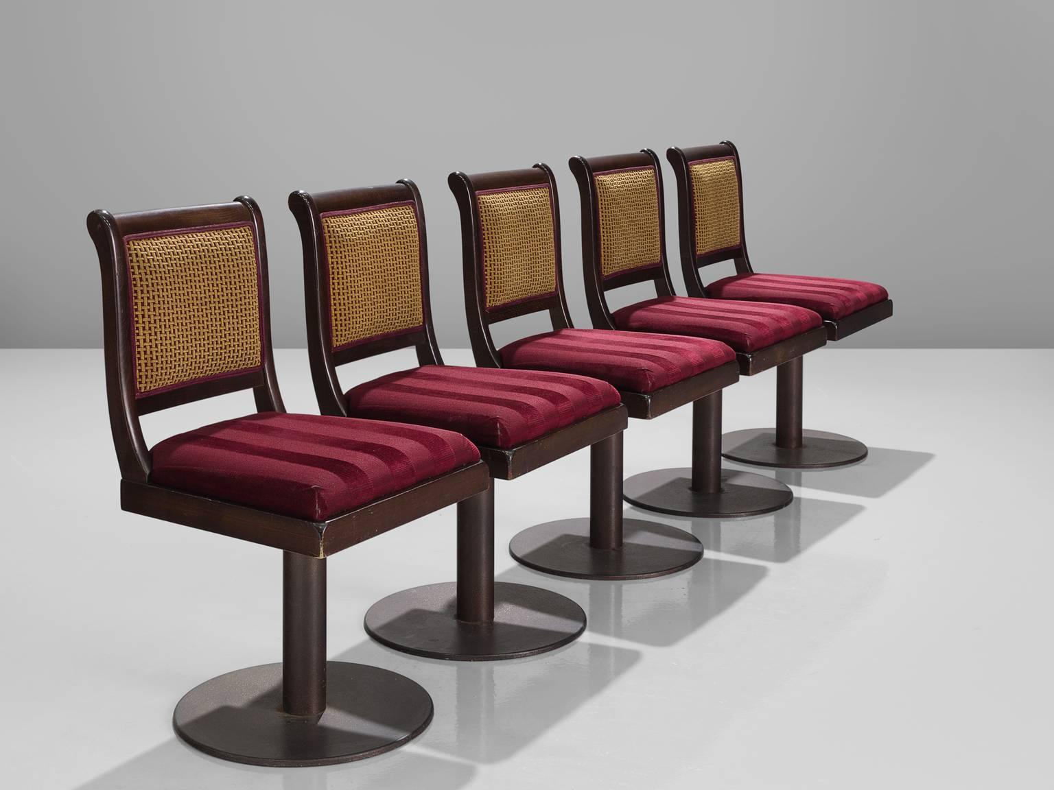 Bar stools, metal, red to purple fabric, stained wood, cane, Italy, 1980s.

This set of Classic Italian Casino barstools is upholstered with the original red striped fabric on a metal base. The stools have square seat with striped red original
