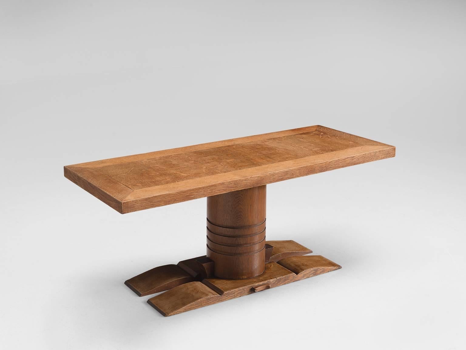 Charles Dudouyt table, light oak, 1940s, France. 

Dining table designed by Charles Dudouyt. As many of the furniture designed by this designer this table has a strong and bold character in both the base and top. It features a geometric pattern on