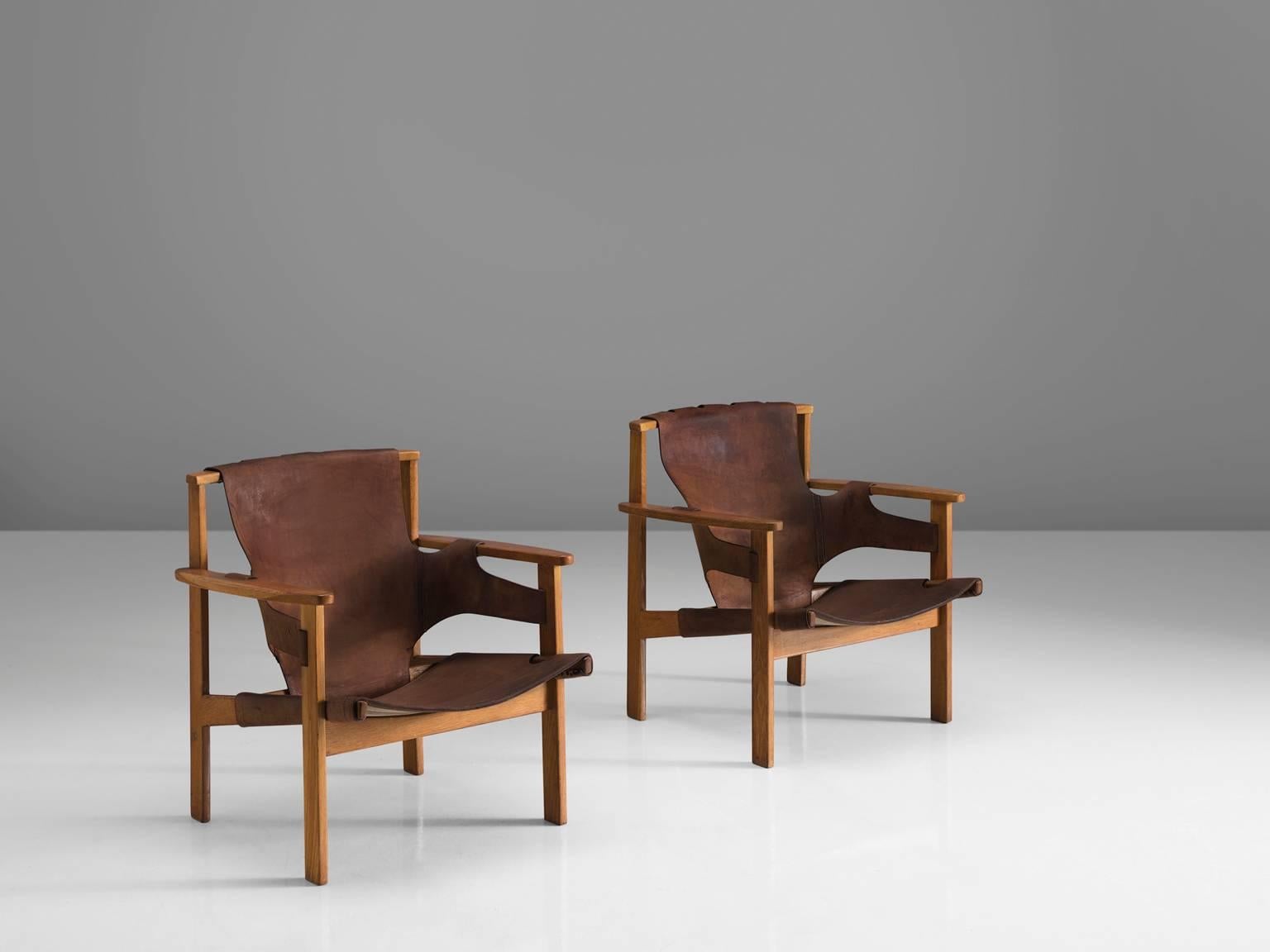 Carl-Axel Acking for NK (Nordiska Kompaniet), 'Trienna' chairs, in oak and leather, Sweden, 1957.

These robust chairs are designed by the Swedish architect Carl-Axel Acking and produced by Nordiska Kompaniet. The name of the chair is derived from