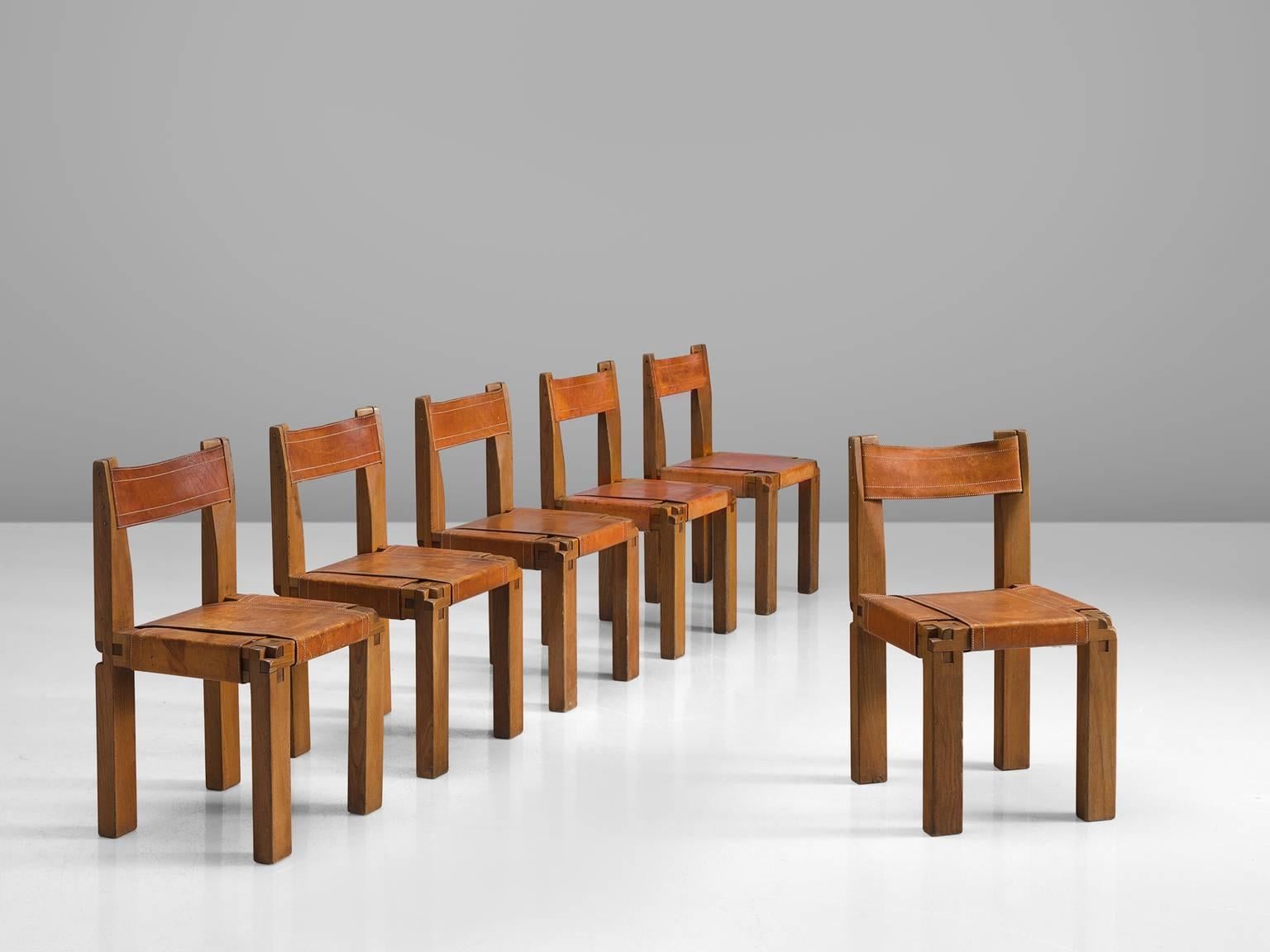 Pierre Chapo, set of six dining chairs, model S11, in elm and leather by France, circa 1955.

Large set of six chairs in solid elmwood with saddle leather seating and back. Designed by French designer Pierre Chapo for Atelier Chapo, Paris. These