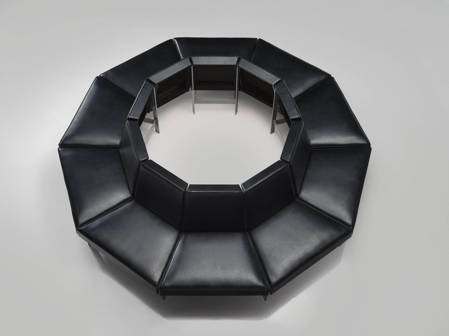 Sofa, black faux leather, steel, Europe, 1960s

This set of ten faux leather sectional benches with metal frame together form semicircle. The seat is executed with soft leatherette that is smoothly upholstered. The construction is geometric, solid