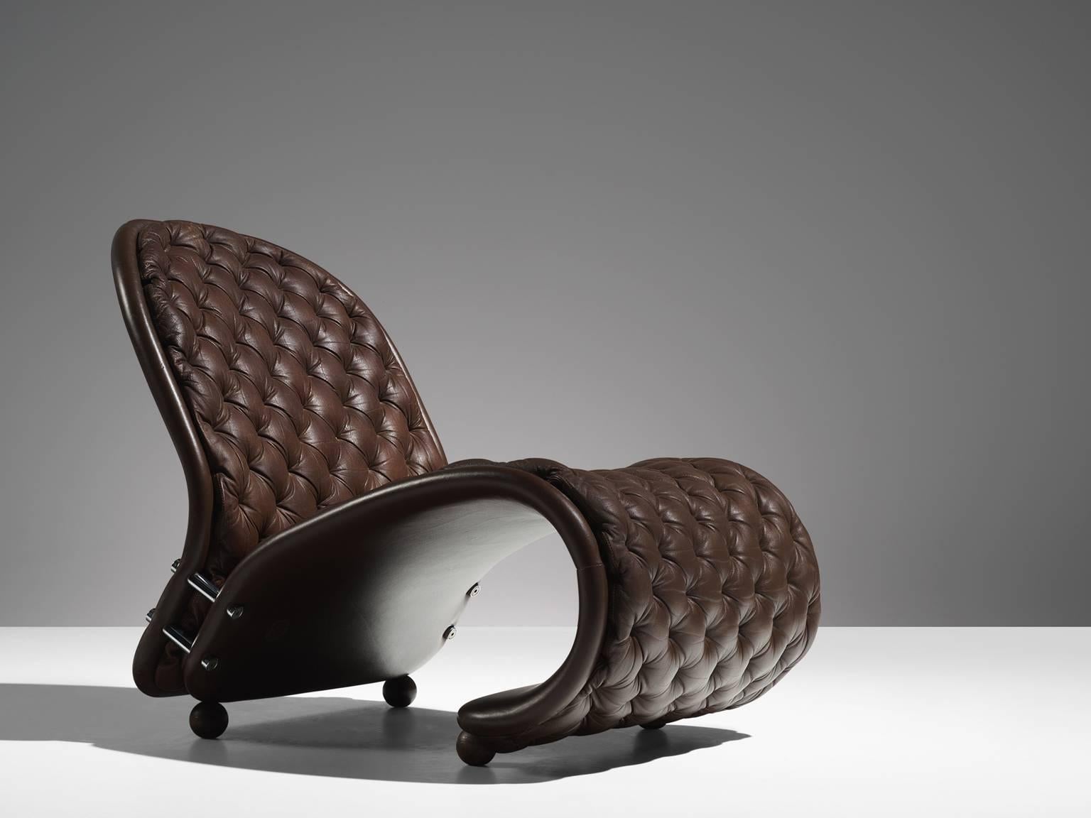 Verner Panton for Fritz Hansen, easy chair 'Model G', in brown leather, Denmark, 1973. 

'Model G' chair from the 1-2-3 system in dark brown tufted leather. This lounge chair features a distinctive shape. This icon is designed by Verner Panton in