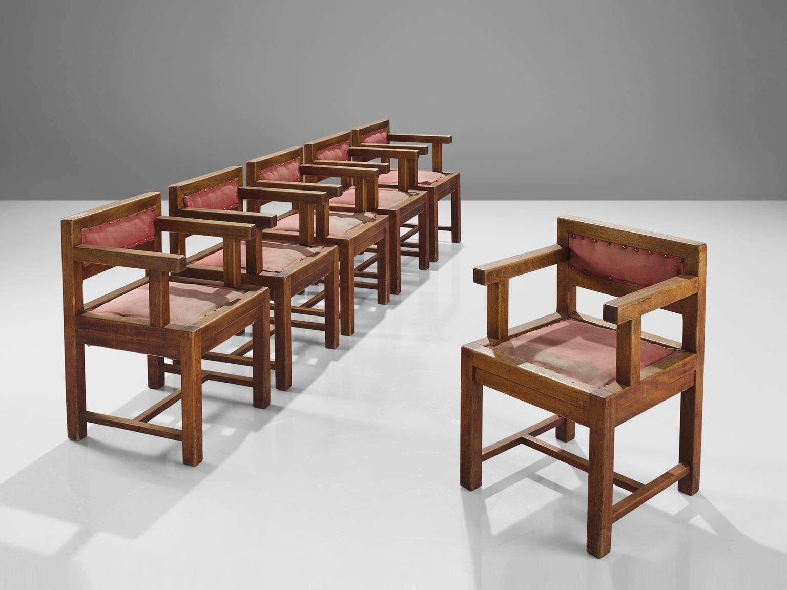 Set of six armchairs, in mahogany and red to pink fabric, France, 1930s.

This set of six solid dining chairs in mahogany with red fabric upholstery have a clear design of straight lines and have a stately appearance. No diagonals or curves, just