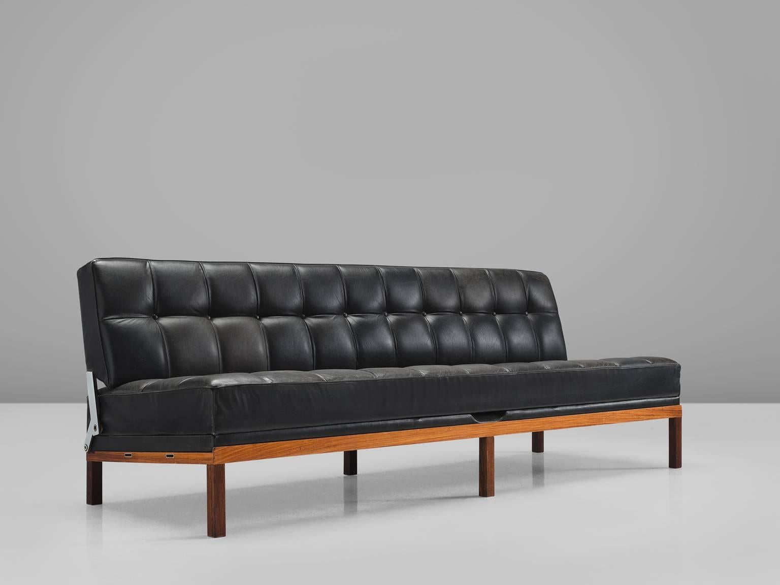 Johannes Spalt for Wittmann, black leather, rosewood, Austria, 1960s. 

This Austrian daybed is named 'Constanze'. This early model, with rosewood frame and black leather cushions is hard to find. Very elegant six slim legs which create an open