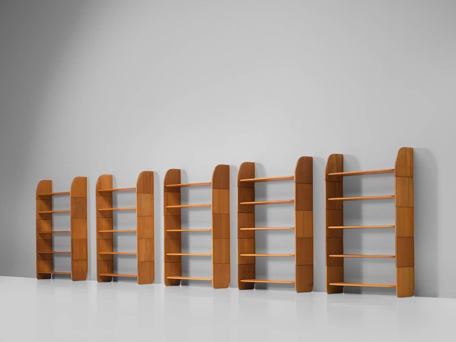 Arthur Milani, Bookshelves, solid pine, Swiss, 1947.

This set of five bookcases in solid pine are part of the midcentury design collection. This set of shelves has a nice simplified yet elegant design. The pine planks on each side become smaller