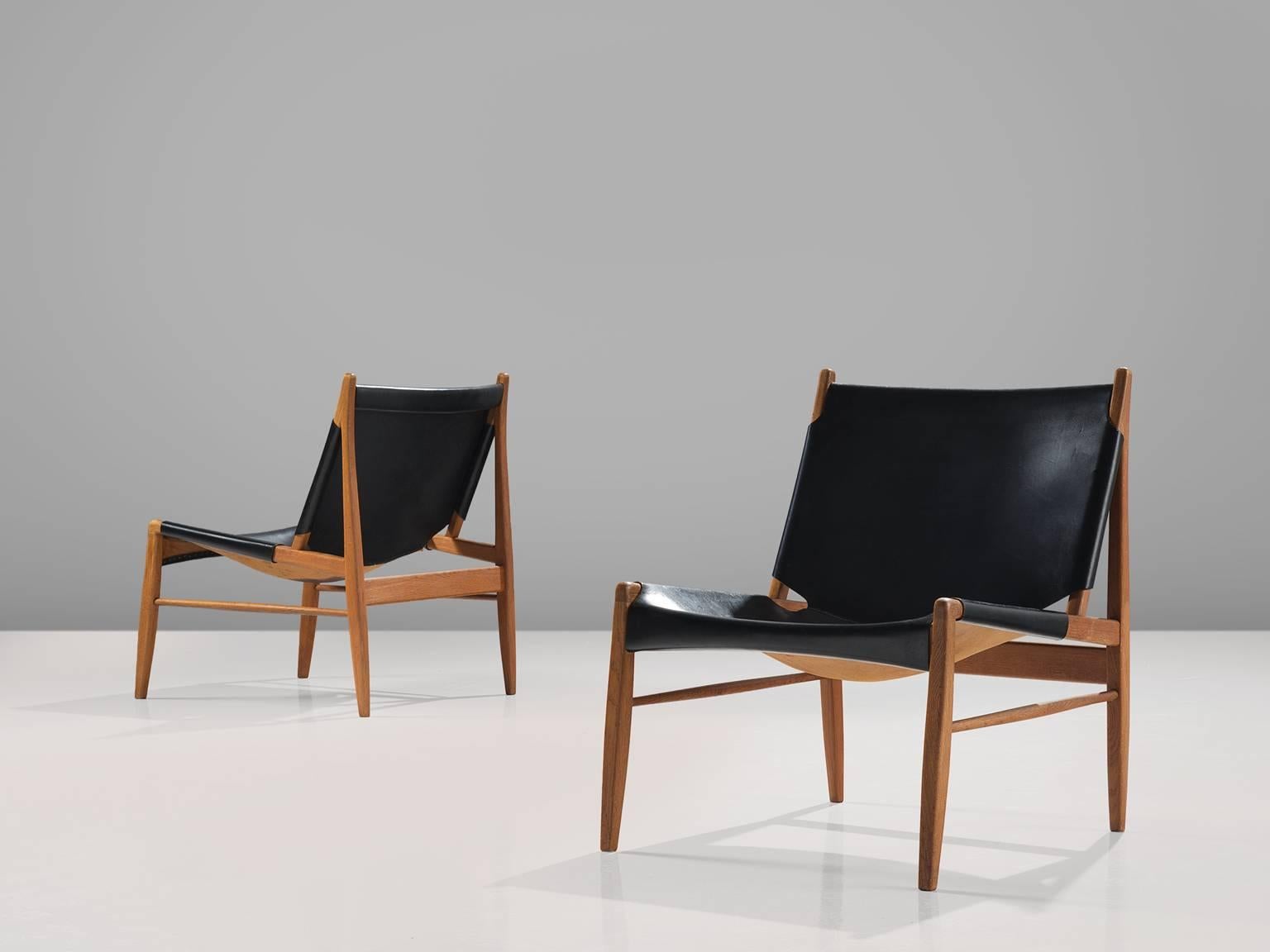 Franz Xaver Lutz for WK Verband, 'Chimney' chairs, oak and patinated black leather, Germany, 1958. 

These early Chimney chairs by Franz Xaver Lutz bear strong resemblances to Spanish and Scandinavian hunting chairs. The design is aptly named