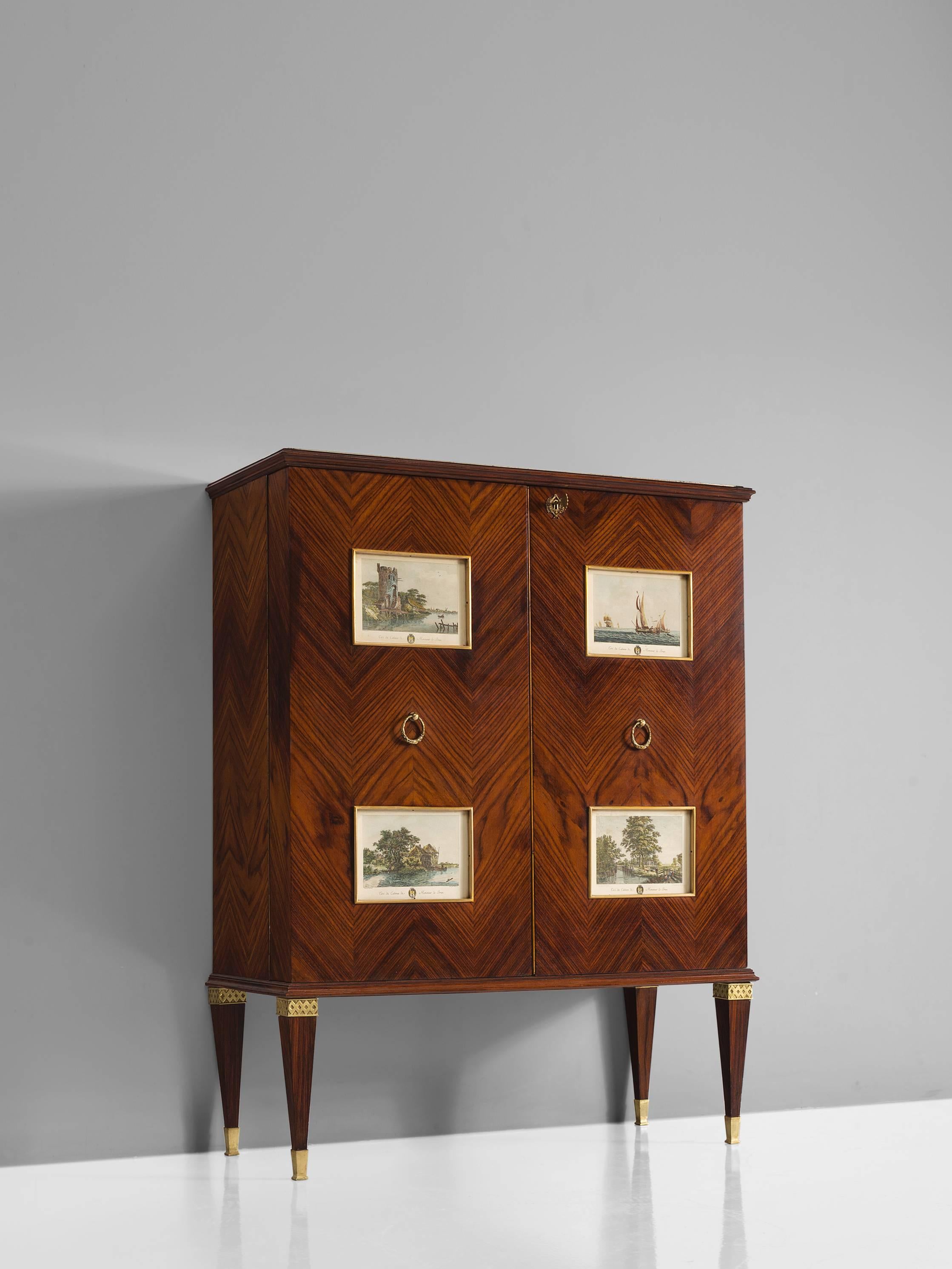 Paolo Buffa, dry bar cabinet, in rosewood, brass and glass, Italy, 1940s. 

This large liquor cabinet by Paulo Buffa is part of the midcentury design collection. The rosewood veneered bar features herringbone illuminated prominent doors which are