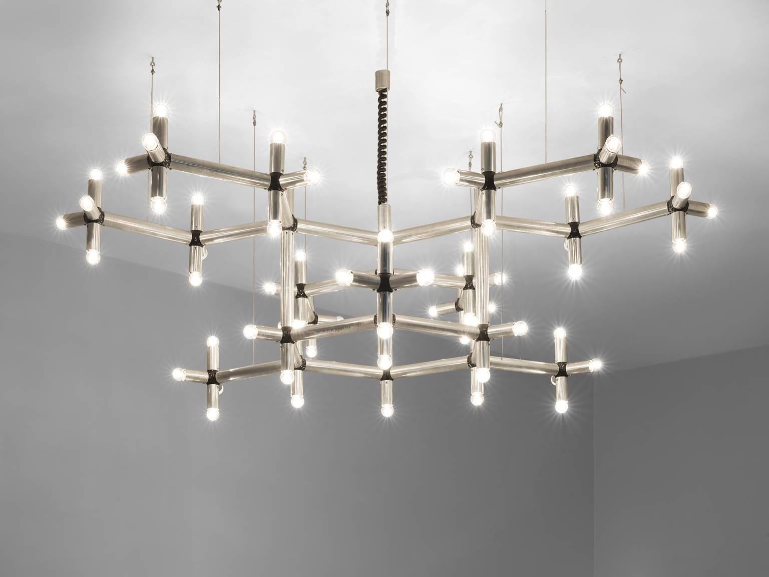Robert Haussmann, chandelier, polished steel with 70 bulbs, Europe, 1970s.

This chandelier is part of the Morentz midcentury design collection. The chandelier is executed in chromed steel and features a frame that spreads out as if it were a