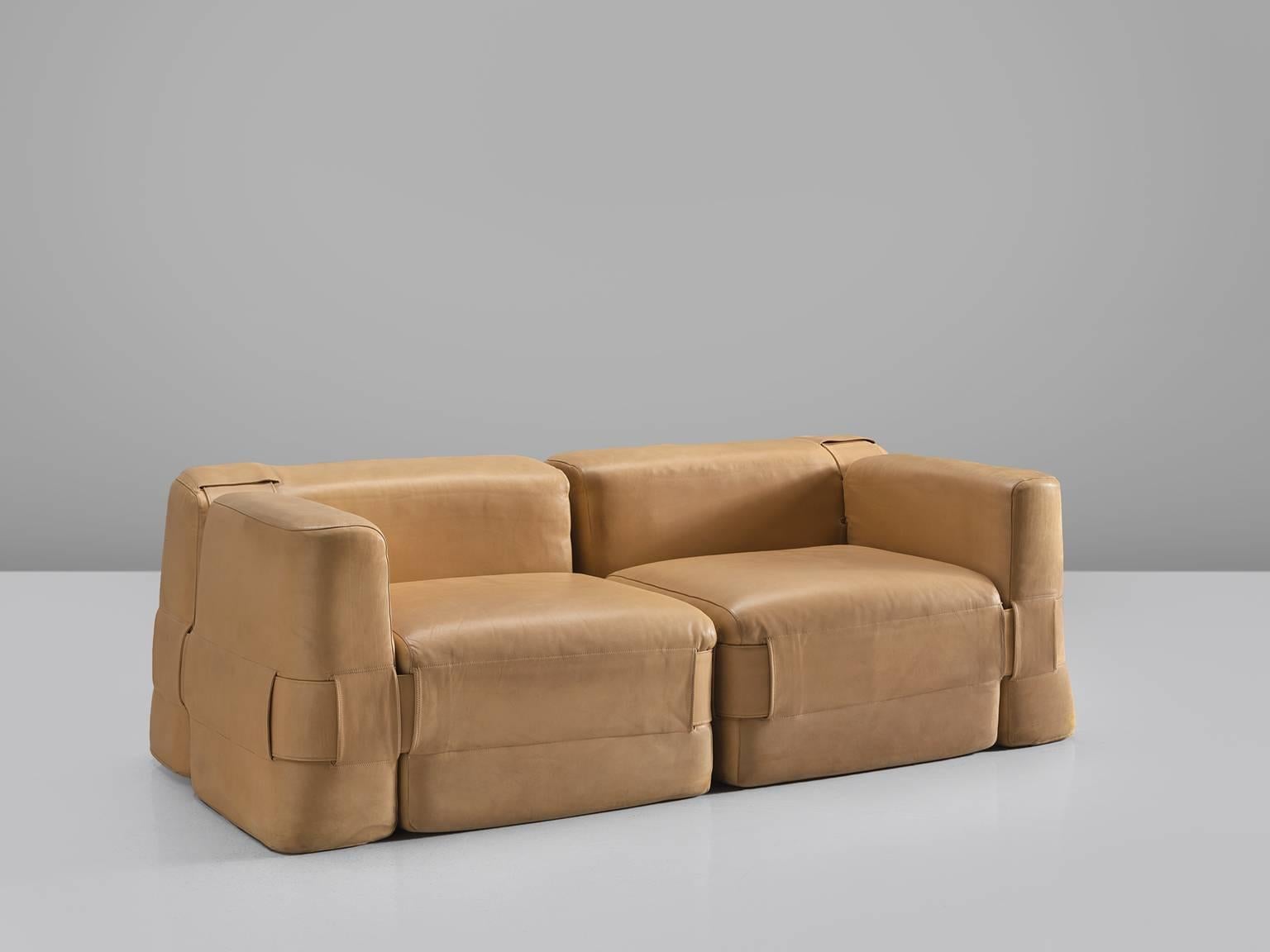 Mario Bellini for Cassina, sofa model 932, cognac leather, Italy, 1964

Mario Bellini designed this modular sofa for Cassina. The sofa is a reinterpretation of classic furniture that always uses padded cushions. He experimented with these cushions