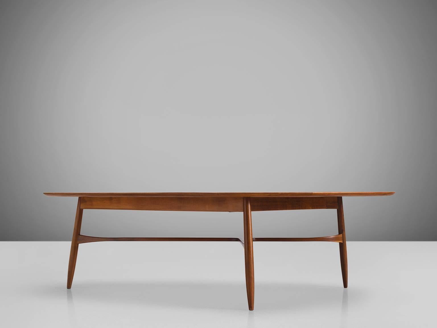 Coffee table, teak, Denmark, 1950s. 

This freely shaped coffee table with three thin tapered legs is part of the midcentury design collection. The legs of the table are beautifully shaped and show high attention to detail, especially by means of