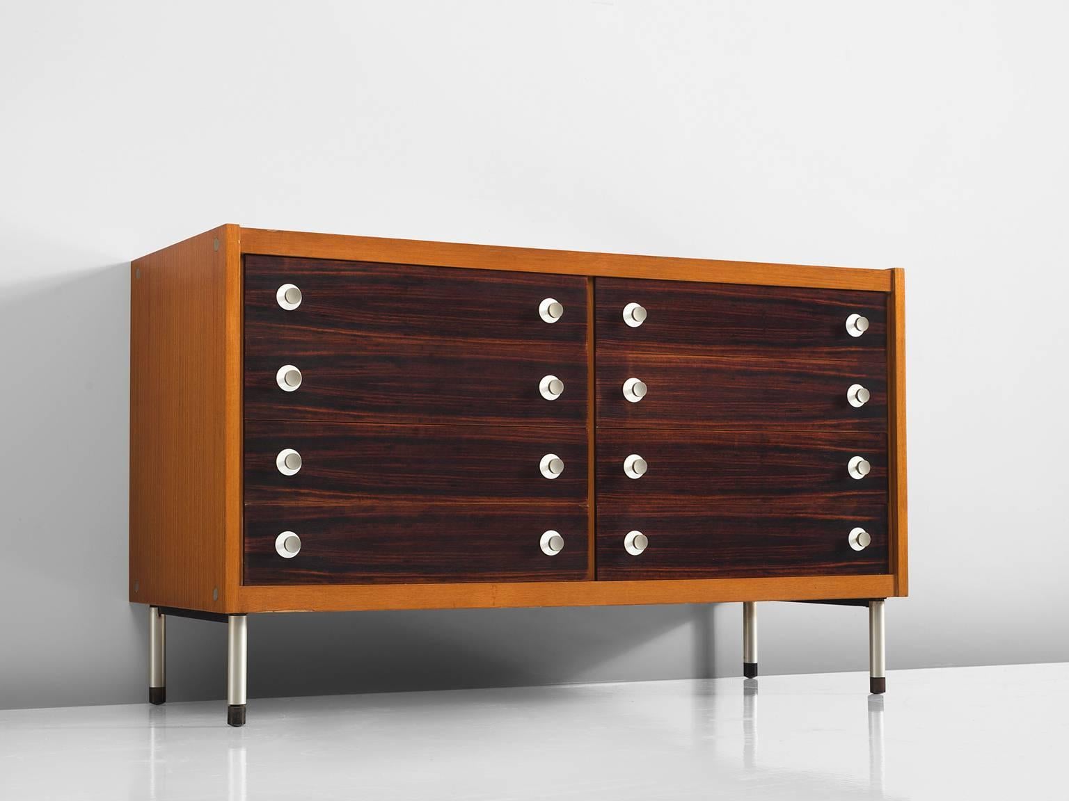 George Coslin, chest of drawers, teak and rosewood, metal, Italy, 1950s.

This Italian cabinet is part of the midcentury design collection. The cabinet is executed in teak and has eight drawers. The legs and handles are made of metal and are