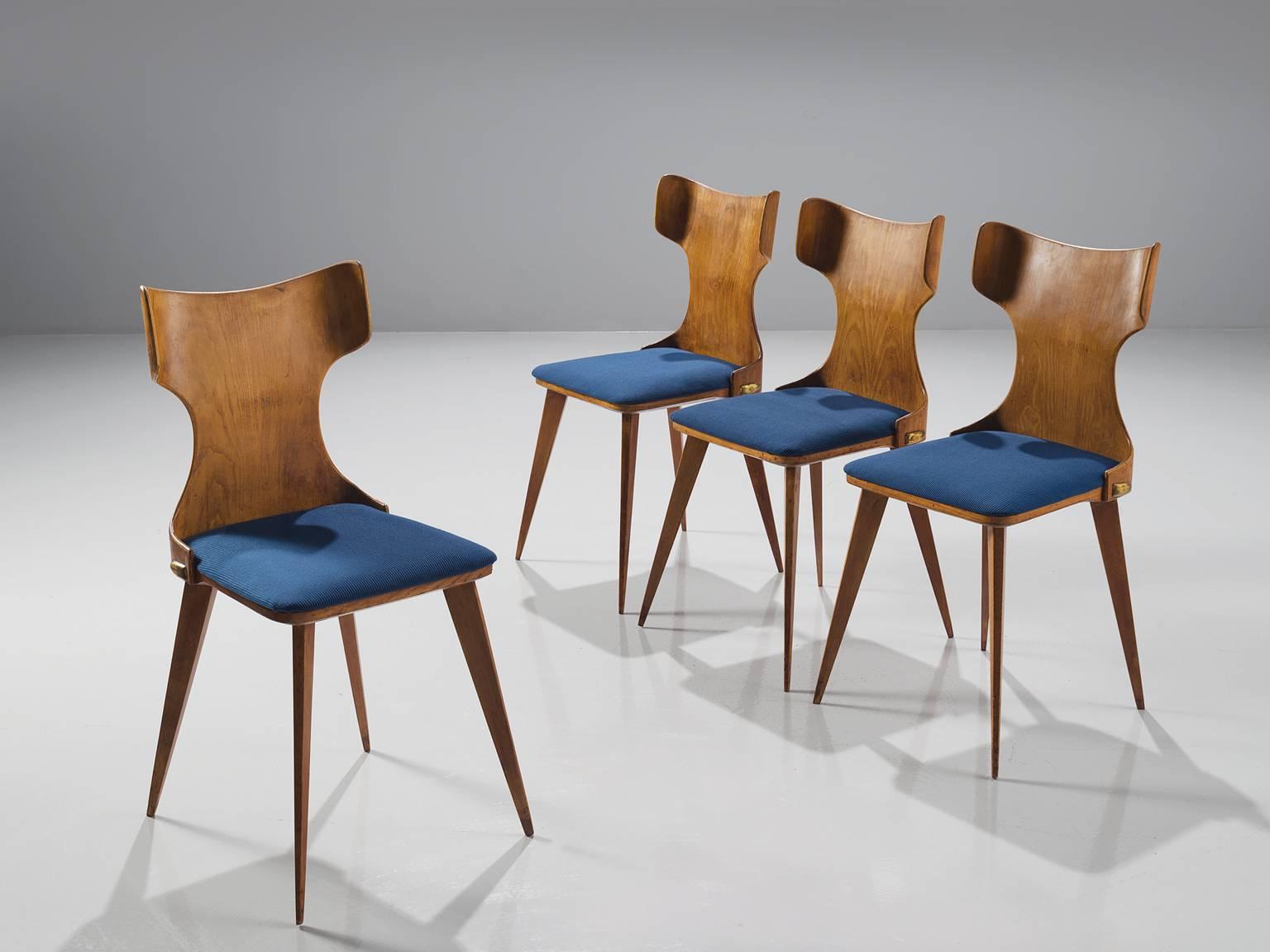 Carlo Ratti, four dining chairs in bent wood and blue fabric, Italy, 1950s.

This Italian set of dining chairs is executed in bent wood and have a blue upholstered seat. The legs are tapered and make these chairs very frivolous and playful. Typical