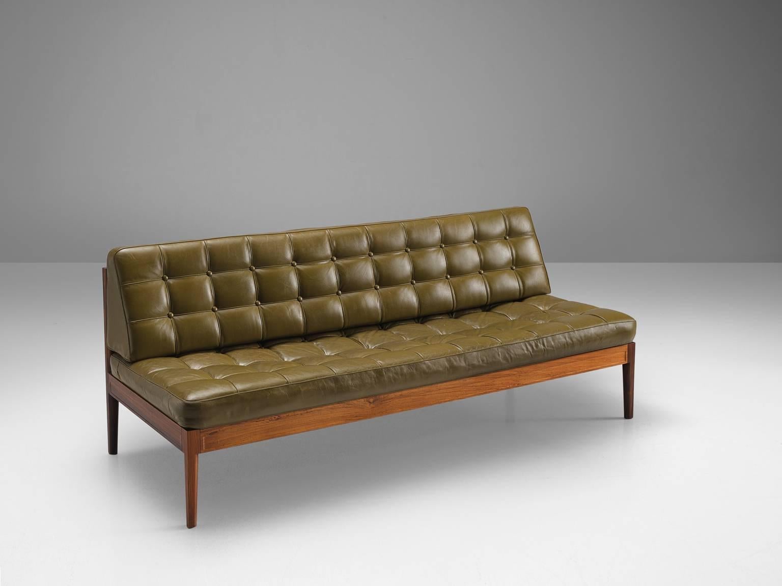 Finn Juhl for France & Søn, 'Diplomat', leather and rosewood, Denmark, 1960s

This solemn rosewood bench is upholstered with an olive green tufted seat and back. The sofa is part of the 'Diplomat' series by the Dane Finn Juhl. The design is both