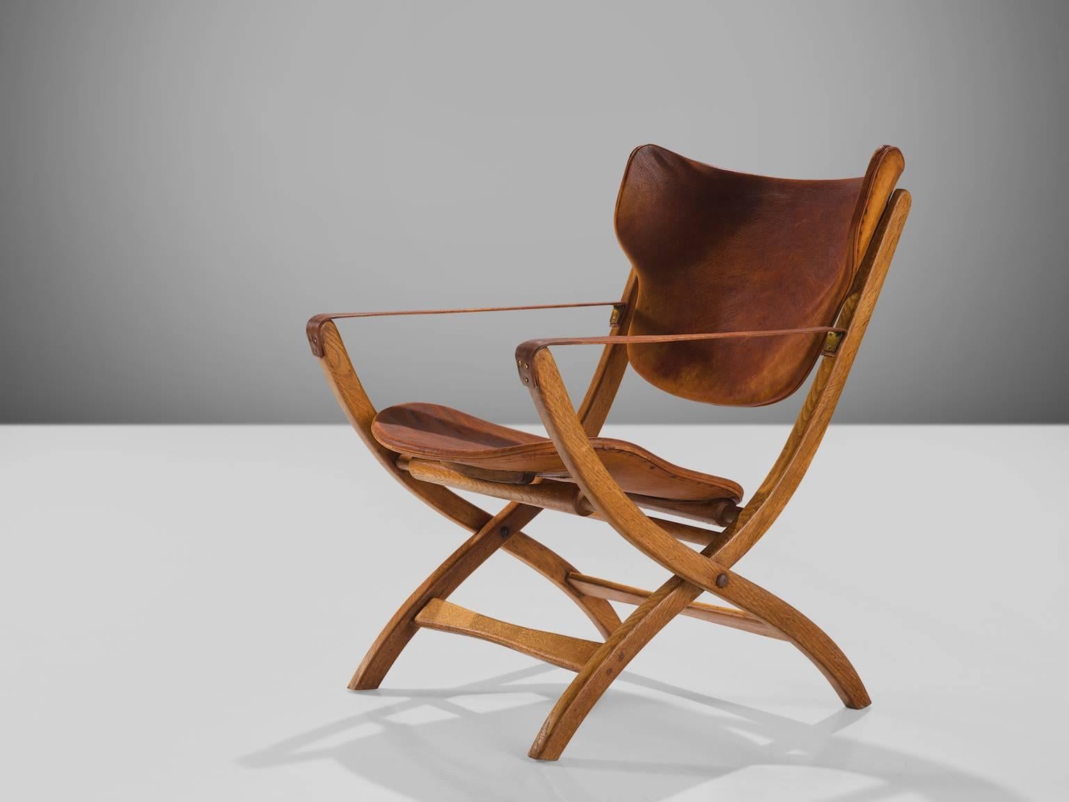 Poul Hundevad, 'Egyptian' chairs, cognac leather, beech and birch, Denmark, 1950s. 

This side chair is part of the midcentury design collection. This folding chair has X- shaped legs that are inspired on ancient Egyptian thrones and chairs. The