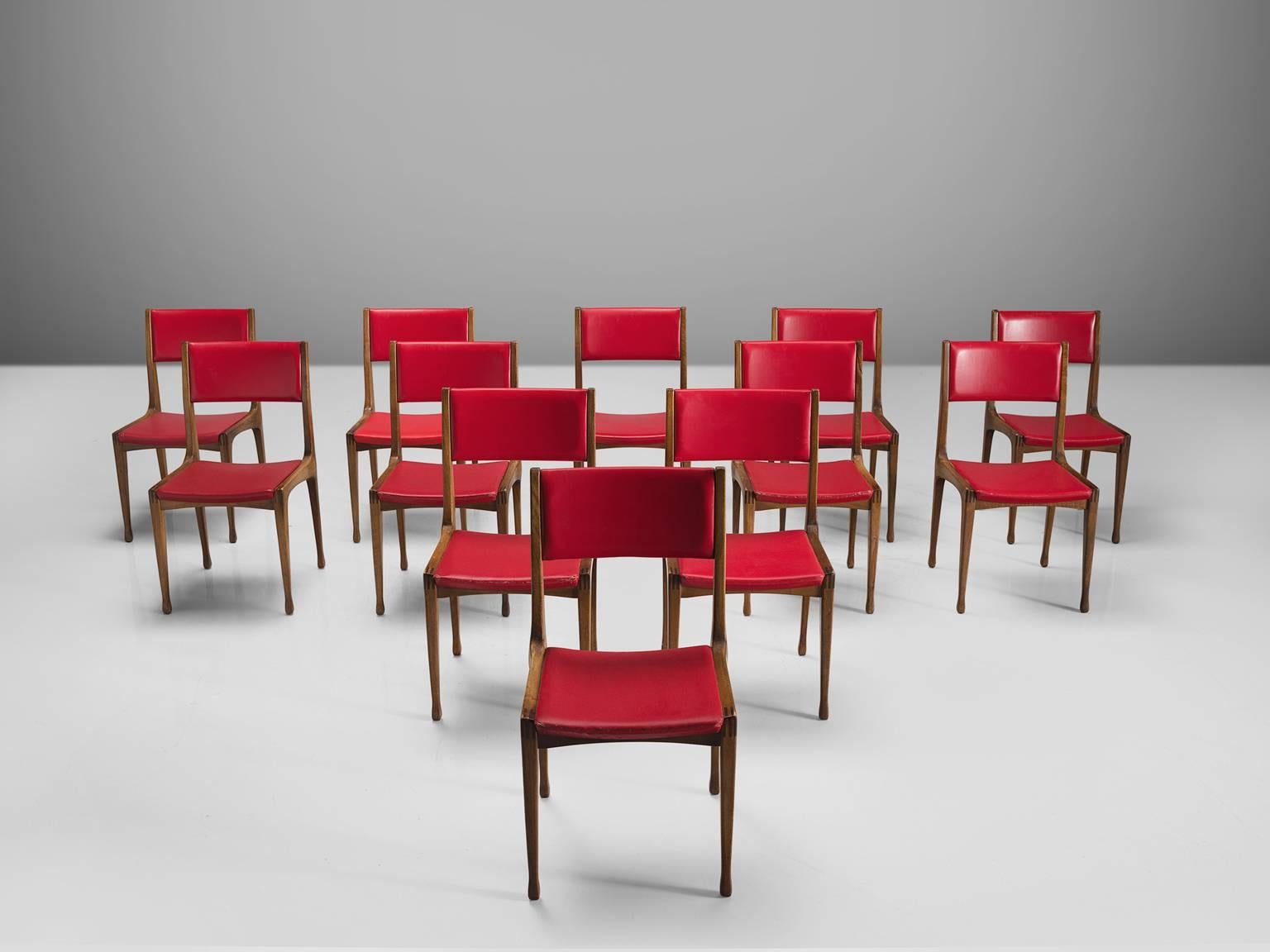 Carlo de Carli for Cassina, set of 12 dining chairs model 693, in walnut and red faux-leather, Italy, 1959.

Set of twelve beautiful dining chairs by Italian designer Carlo di Carli. This set is part of the midcentury design collection. Model 693 is