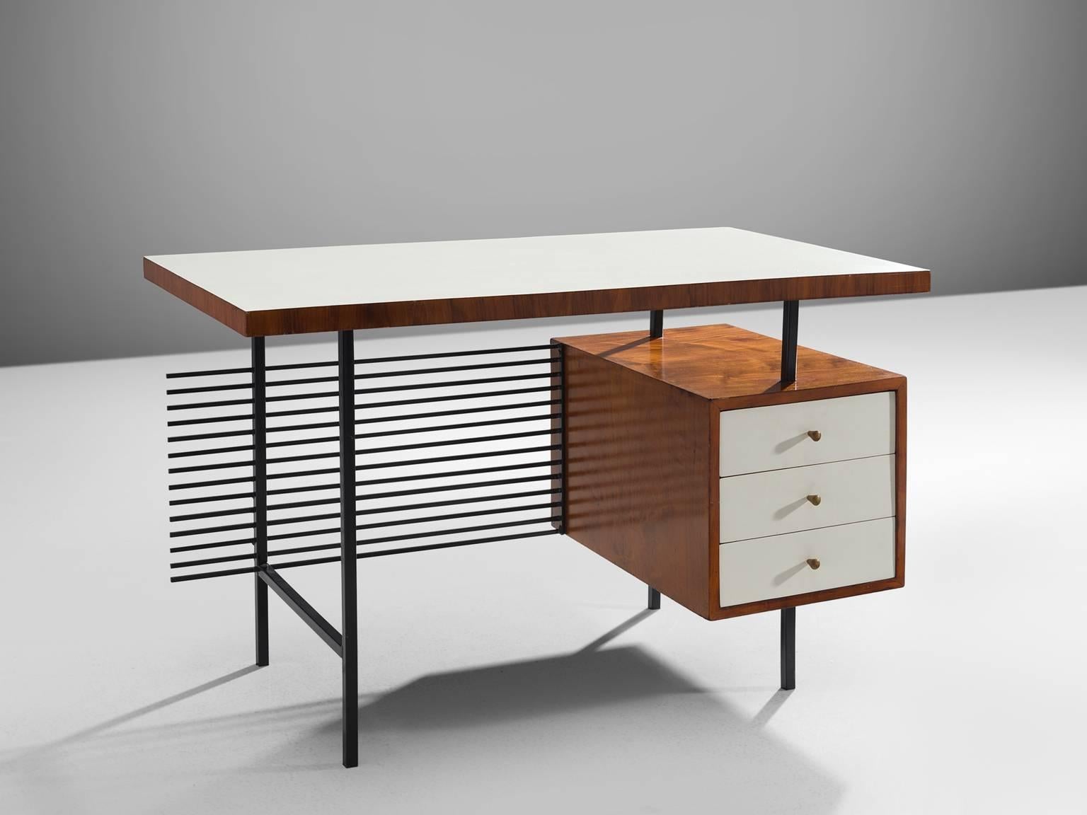 Geraldo de Barros, desk, white formica, rosewood metal, Brazil, 1950s.

This delicate desk is by designed by the Brazilian modernist designer Geraldo de Barros. The most distinct part of this desk is the back were a display of black metal rods are