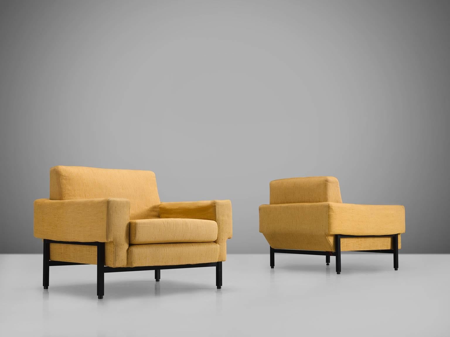 Saporiti, club chairs in yellow fabric, black metal Italy, 1960s.

These chairs, equipped with a metal frame feature a very distinctive sloped back at the bottom. The frame is black and forms a wonderful contrast to the yellow upholstered