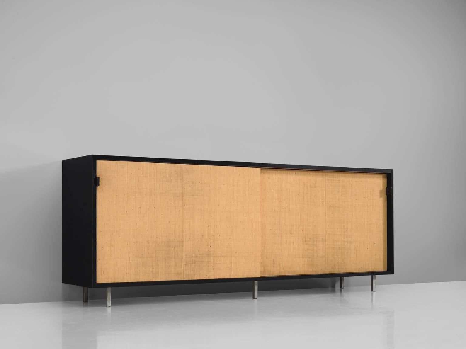 Florence knoll for knoll, cane, black ebonized wood, metal, cane, United States, 1961.

This sideboard is designed by Florence Knoll for Knoll International and was meant for the head office of a bank in Italy. The credenza is executed with two