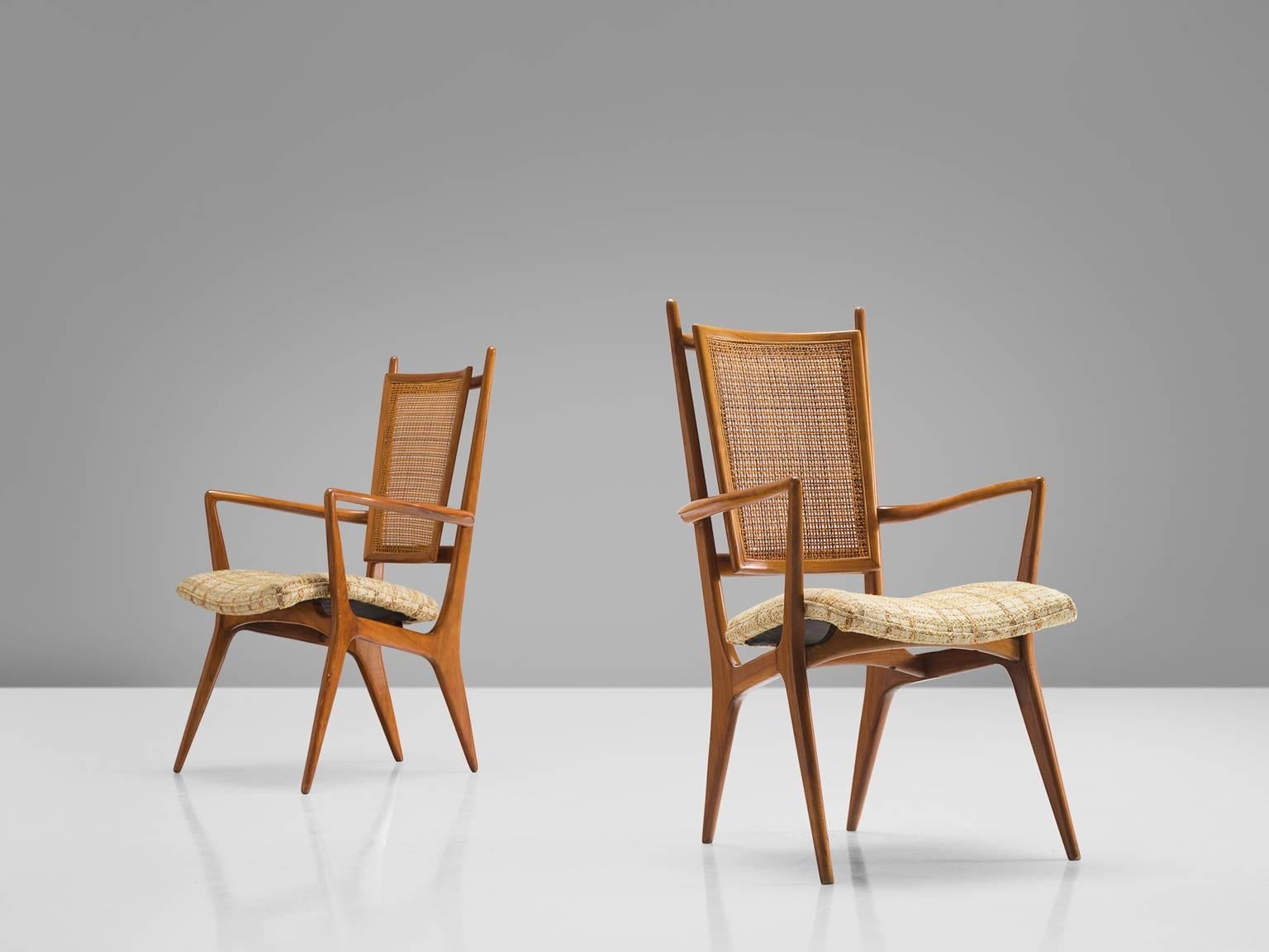 Vladimir Kagan, set of two side chairs, walnut, cane, fabric, United States, circa 1955.

This pair of chairs is designed by Vladimir Kagan for Hugo Dreyfuss. The set of two chairs is sensuous, sculptural and elegant. The chairs feature high backs,