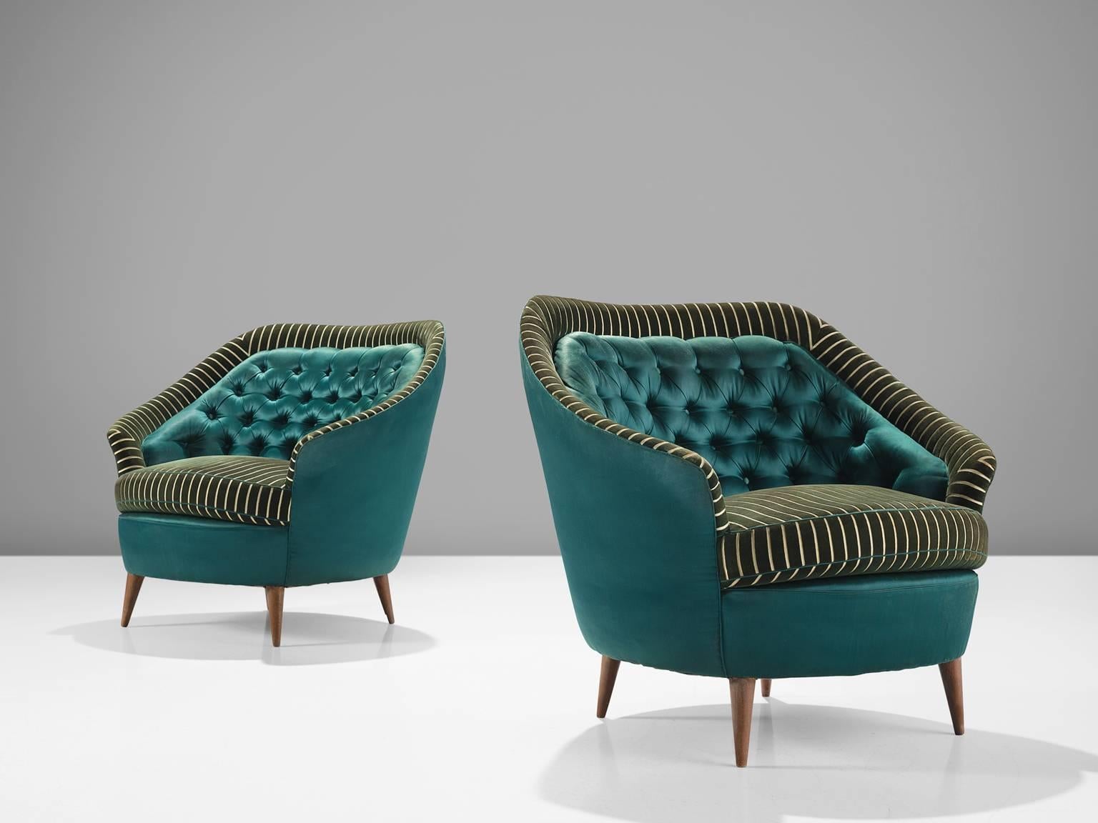 Italian sofa, armchairs, green striped velvet and turquoise satin like fabric, wood, Italy, 1950s.

This set of armchairs is an iconic example of Italian design from the 1950s. The chairs are on the one hand simplistic, with elegant, subtle lines in