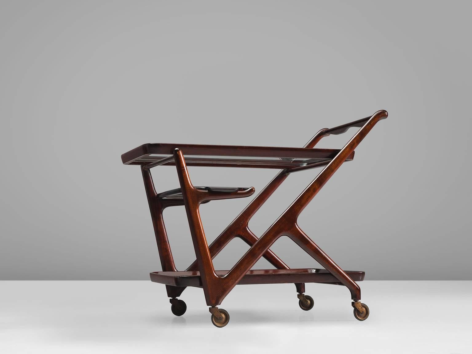 Cesare Lacca, trolley, brass, dark wood and glass, Italy, 1960s. 

This trolley by Cesara Lacca is executed with a wooden frame, glass top and brass wheels. The trolley thus features a wonderful combination of brass and wooden elements. The