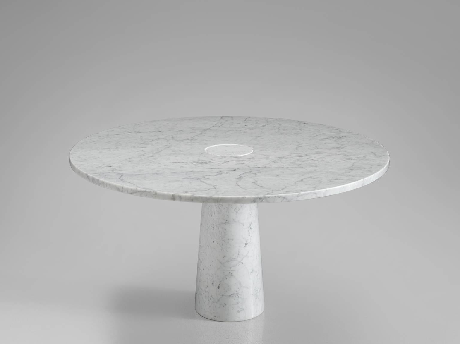 Dining table, marble, Italy, 1970s. 

This architectural table is a skillful example of postmodern design. The circular table features no joints or clamps and is architectural in its structure featuring one single column that is attached to the