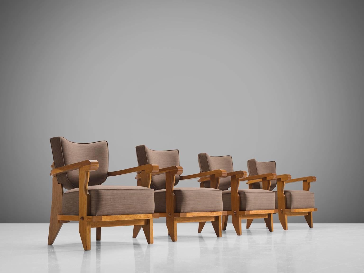 Jacques Chambron and Robert Guillerme, set of four easy chairs, grey fabric, oak, France, 1950s

This sculptural set of easy chairs by Guillerme and Chambron is very well executed and made out of solid, carved blond oak. This set of comfortable