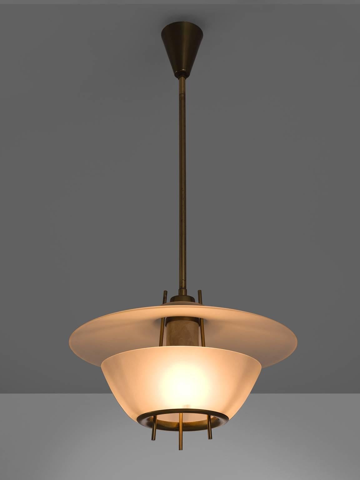 O-Luce, pendant, lucite and brass, Italy, 1960s.

This pendant has a wonderful mounting element in brass, they show the high standard of quality and detail O-Luce is known for. The elegant shades create a wonderful light partition. The pendant is