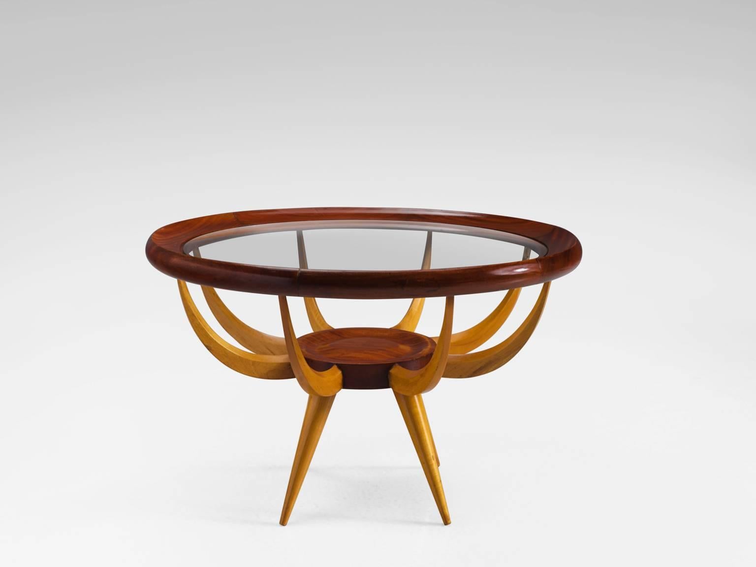 Giuseppi Scapinelli, side table, caviuana and glass, Italy, 1950s

This delicate round side table is designed by the Brazilian designer Scapinelli. The table features delicate organic wooden 'beams' that flow from the middle towards the bottom and