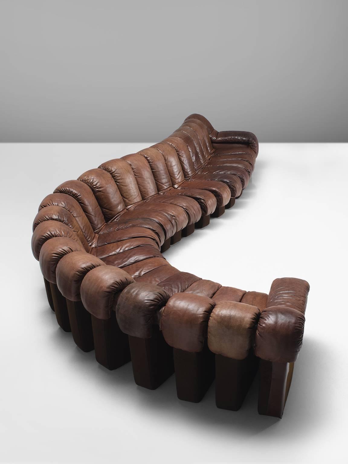 De Sede ‘Snake’ DS-600, brown leather, felt, Switzerland, 1972. 

De Sede 'Non Stop' sectional sofa containing 22 pieces in original dark brown leather, of which two higher armrests. Any number of pieces can be zipped together ensuring an endless