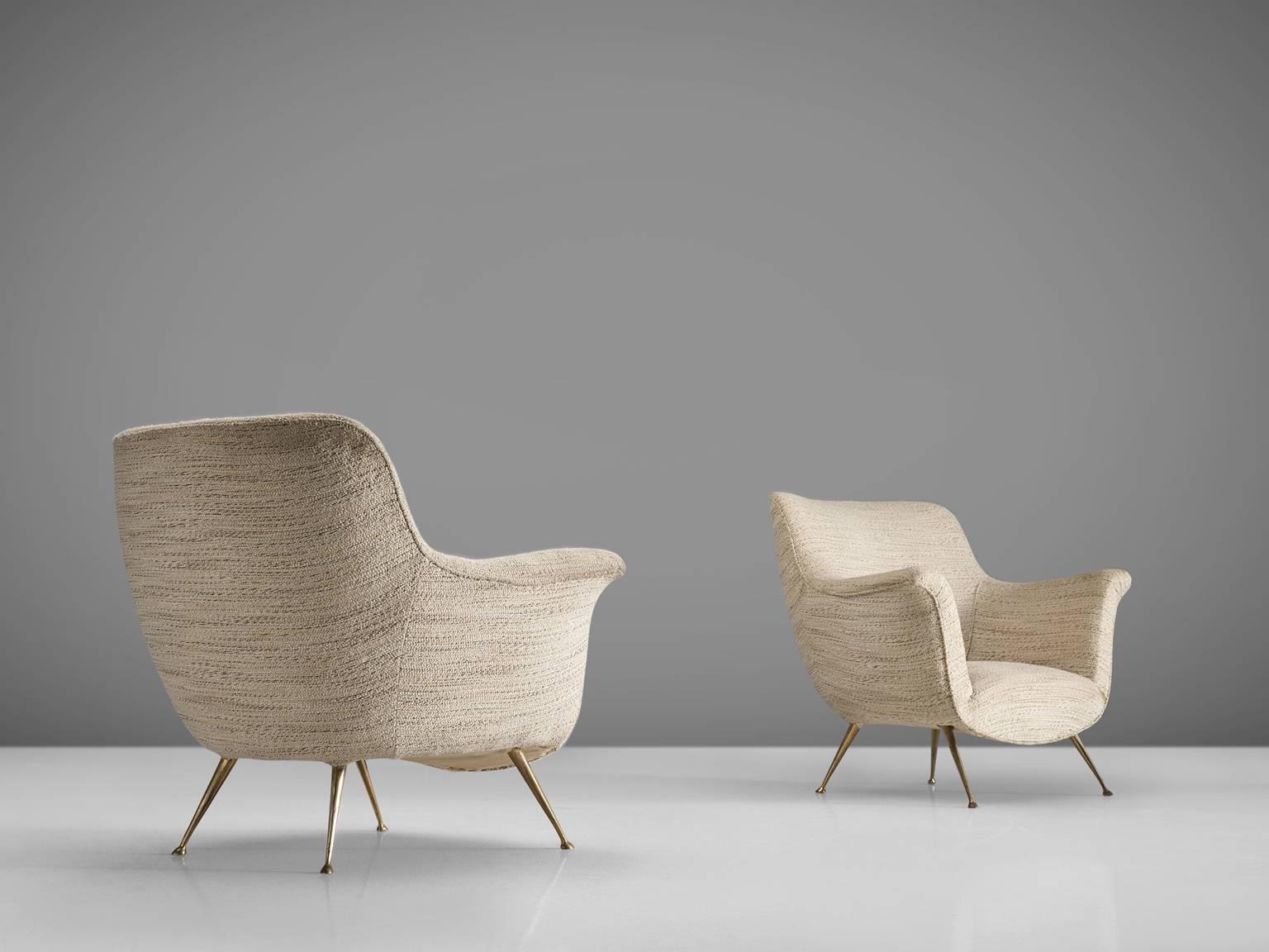 Italian set of lounge chairs, white fabric, brass, Italy, 1950s.

This set of chairs is an iconic example of Italian design from the 1950s. The design is on the one hand simplistic, with elegant, subtle lines. On the other hand the set has a
