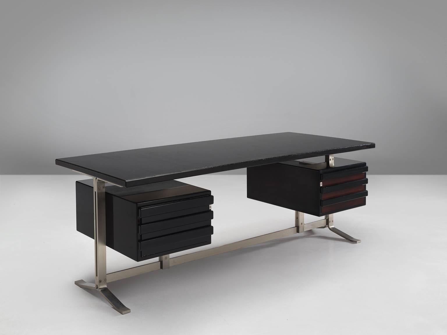 Gianni Moscatelli for Forma Nova, Minister's desk, steel and wood, Italy, 1969.

Minister's desk in black with rectangular top resting on two side boxes with a base in curved metal blades. The leg of the desk has a steel frame and two sled feet.