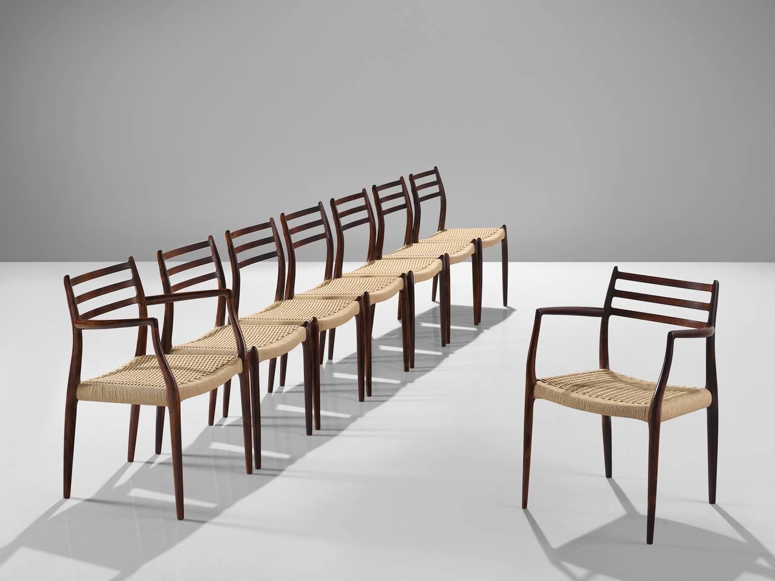 Niels Otto Möller for J.L. Møllers Møbelfabrik, set of eight dining chairs model 85 and two armchairs model 62, rosewood and wickered cane, Denmark, 1960s.

These iconic dining chairs by Möller are upholstered with cane by our upholstery studio.